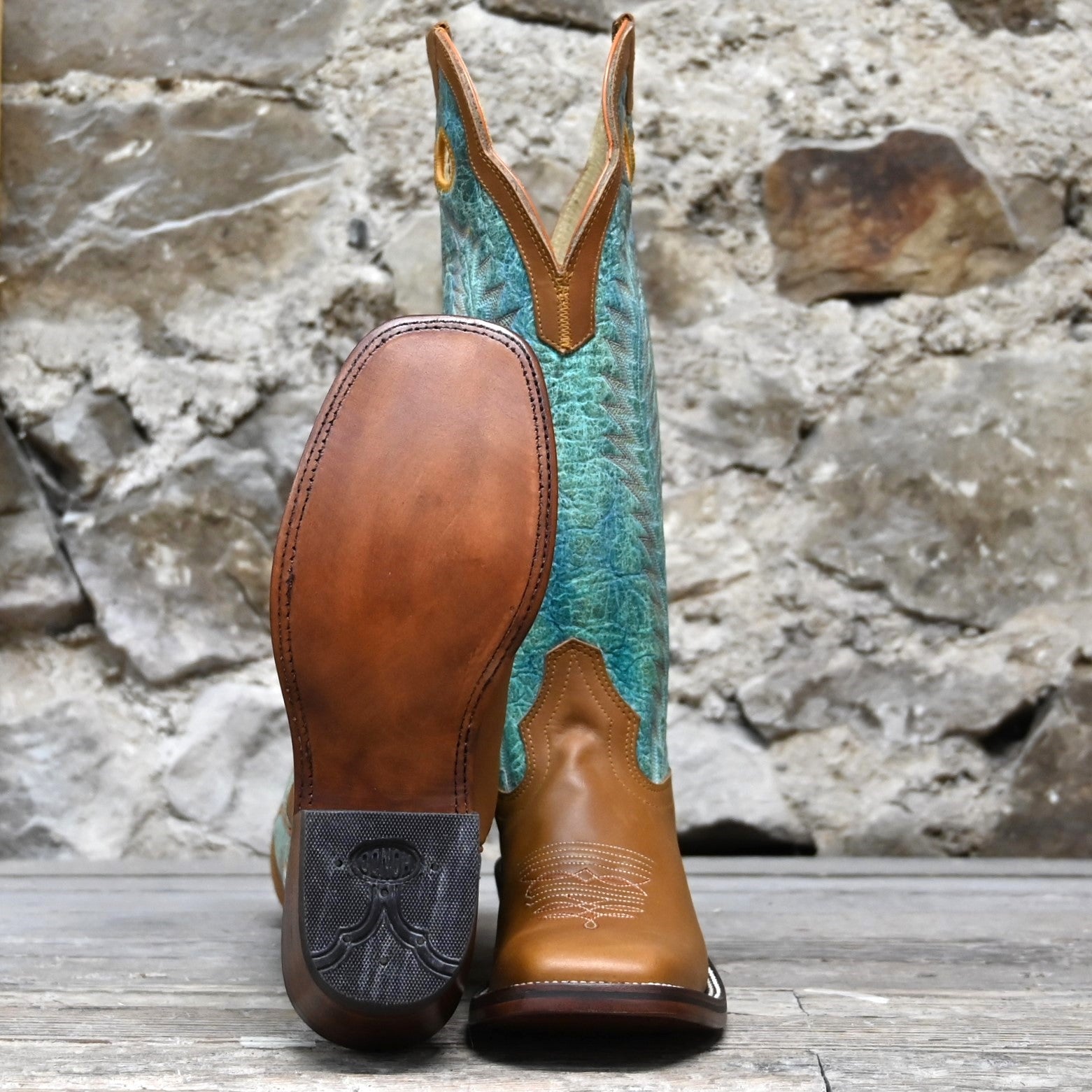 View of Hondo 16" cowboy boot with turquoise crater top, honey crazy horse vamp, wide square toe, and pull holes