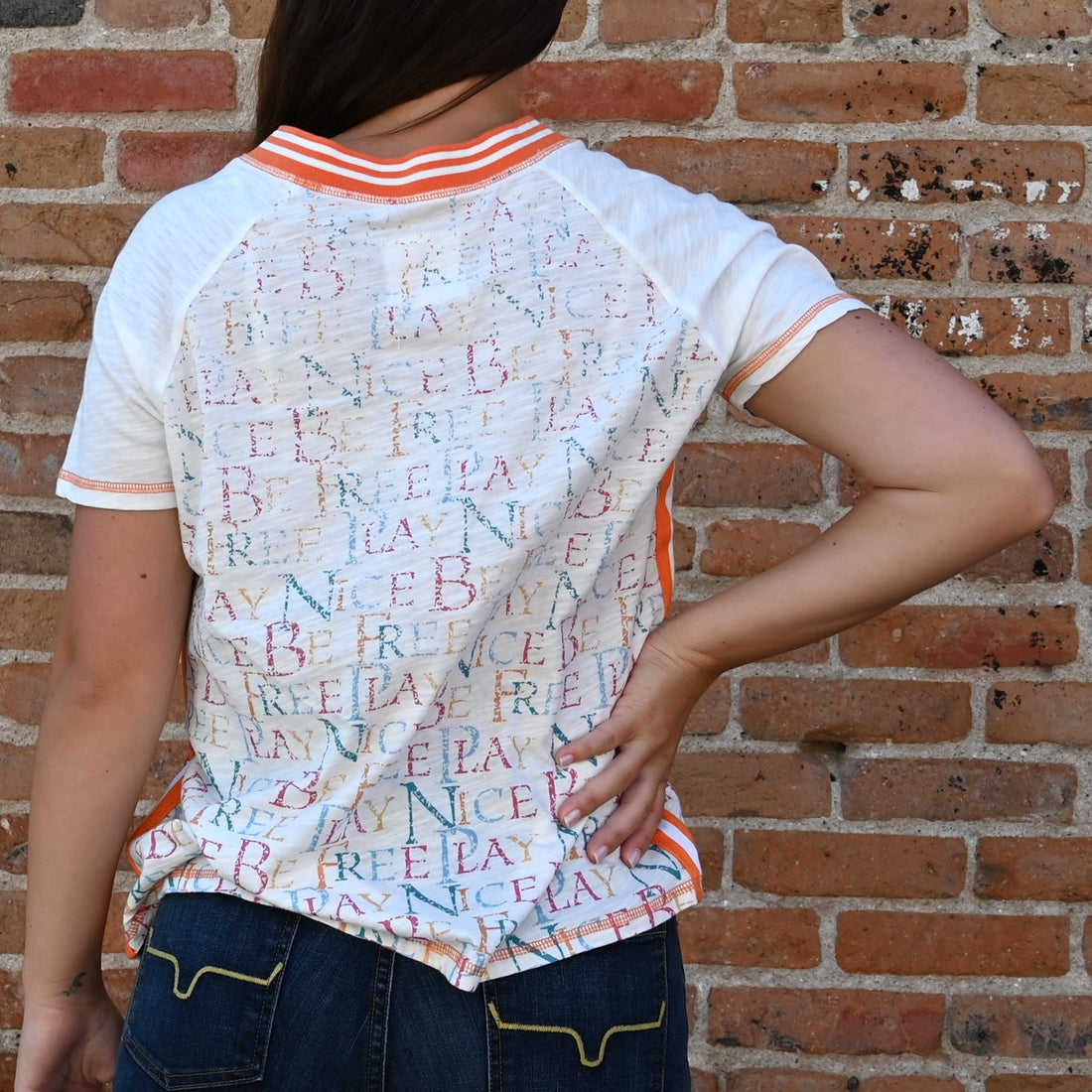 View of Double D Ranch Trail Ride Top in Cloud featuring retro racing stripes, saddle design, and sport ribbing trim