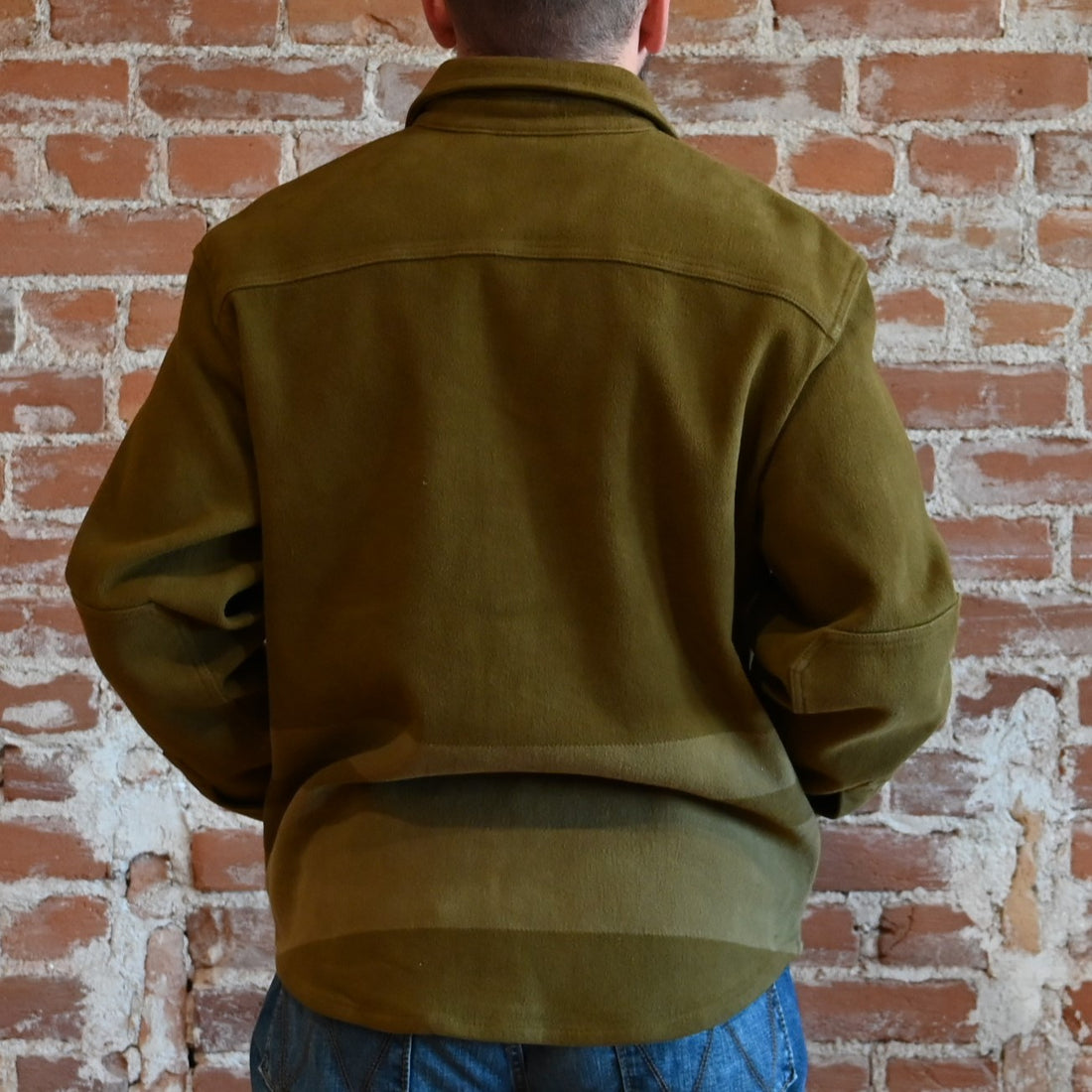View of Filson Beartooth Jac-Shirt in Marsh Olive Stripe featuring snap-flap chest pockets and reinforced forearms