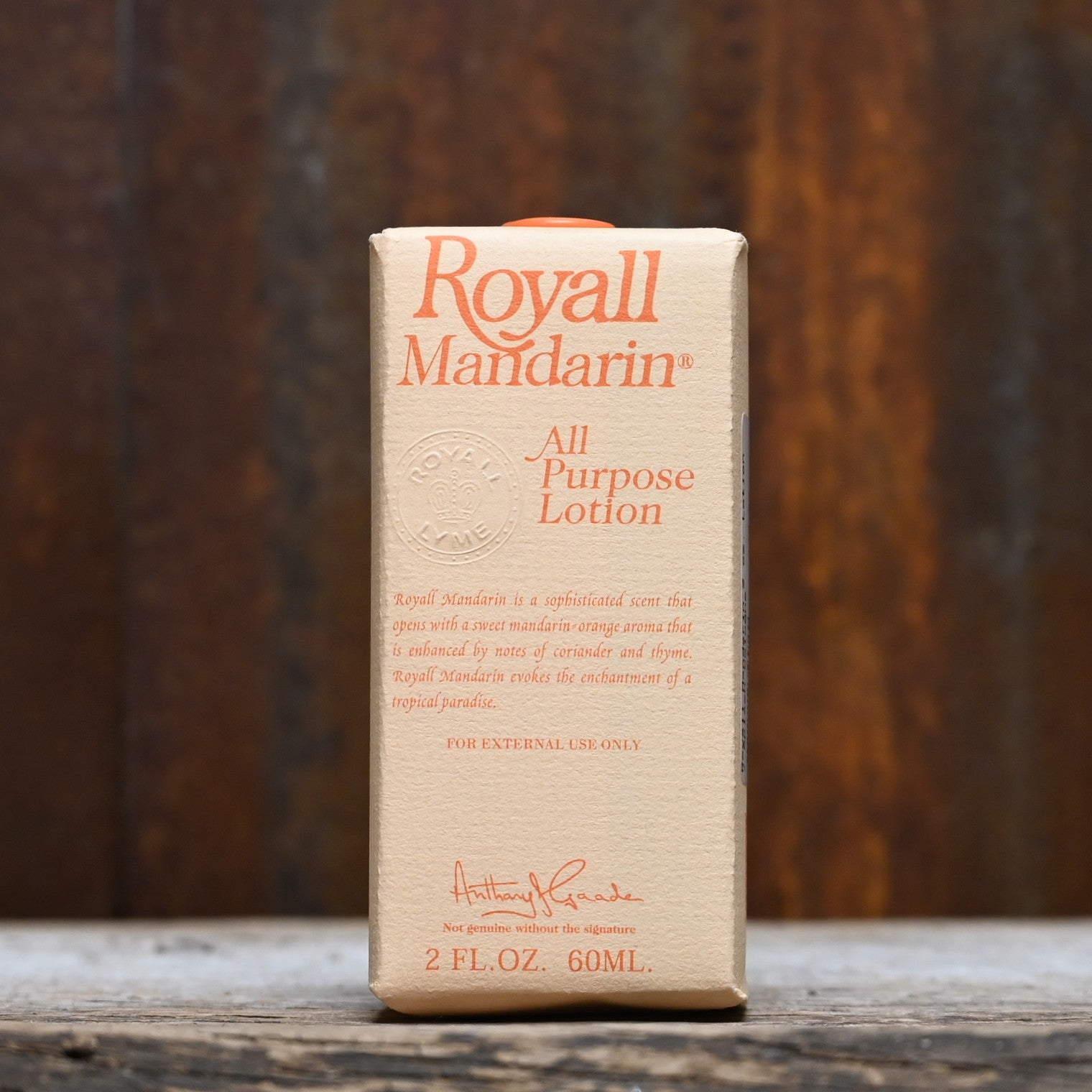 Royall Mandarin 2 oz bottle of all-purpose lotion and splash cologne in orange glass with gold cap