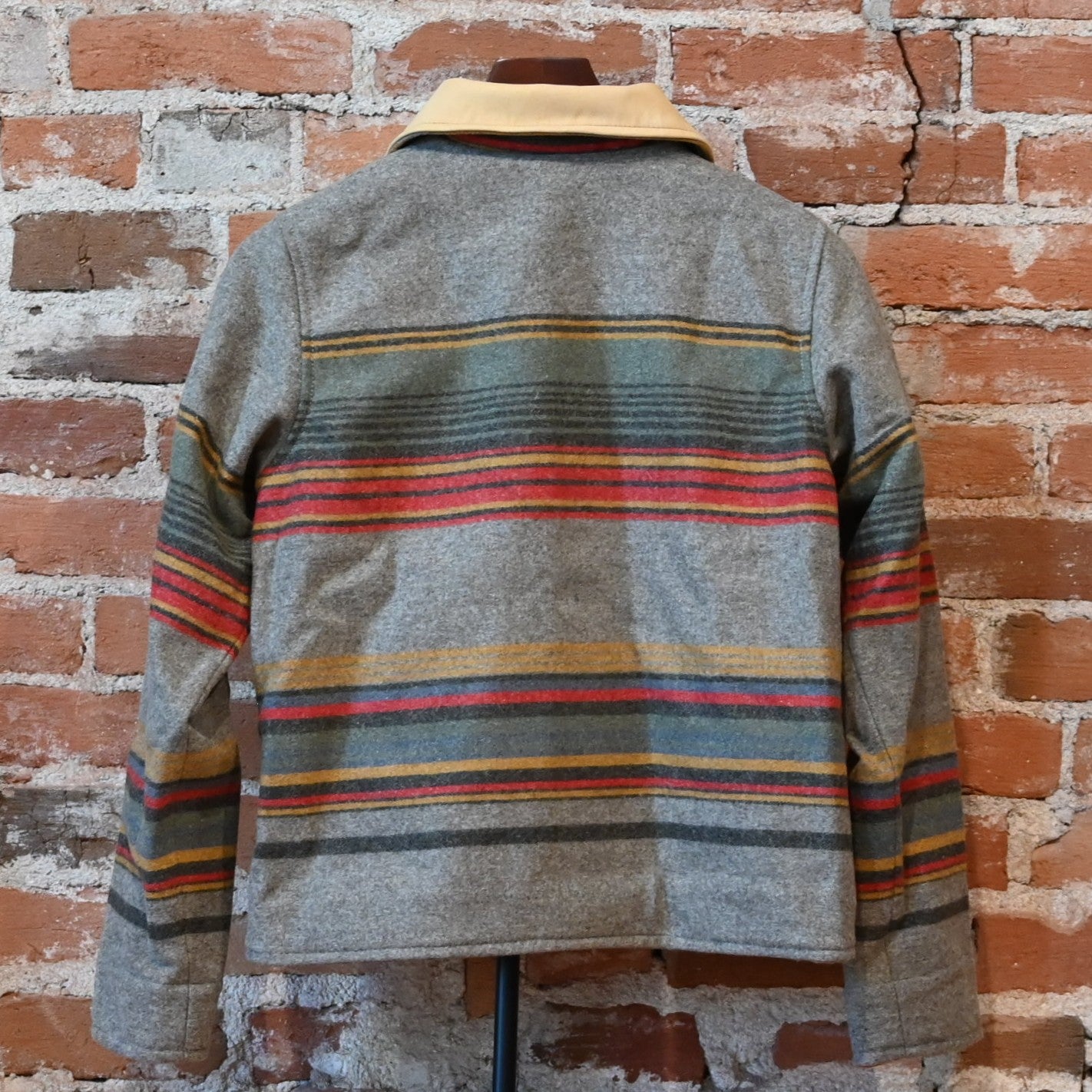 Schaefer Outfitter Ladies Las Cruces Jacket in taupe stripe wool with lamb suede collar and concho buttons