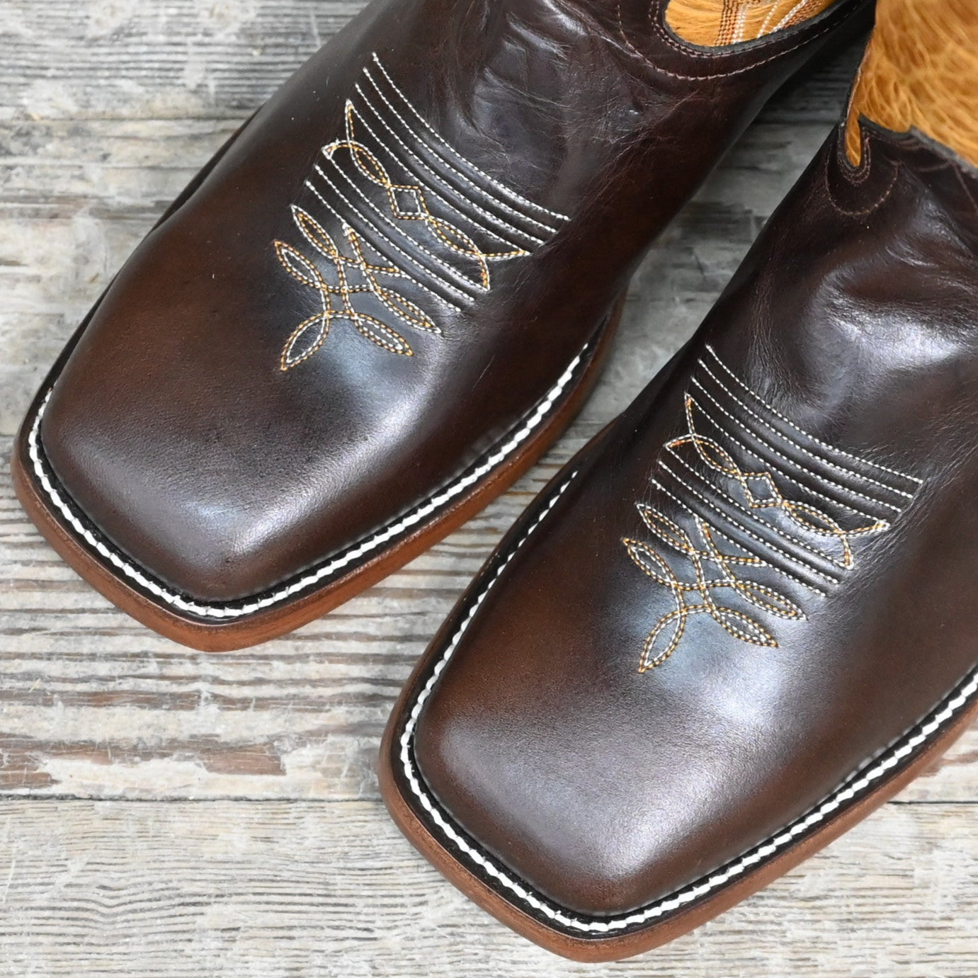 View of Hondo 16" cowboy boot with brown top, brown crazy horse vamp, wide square toe, and pull holes