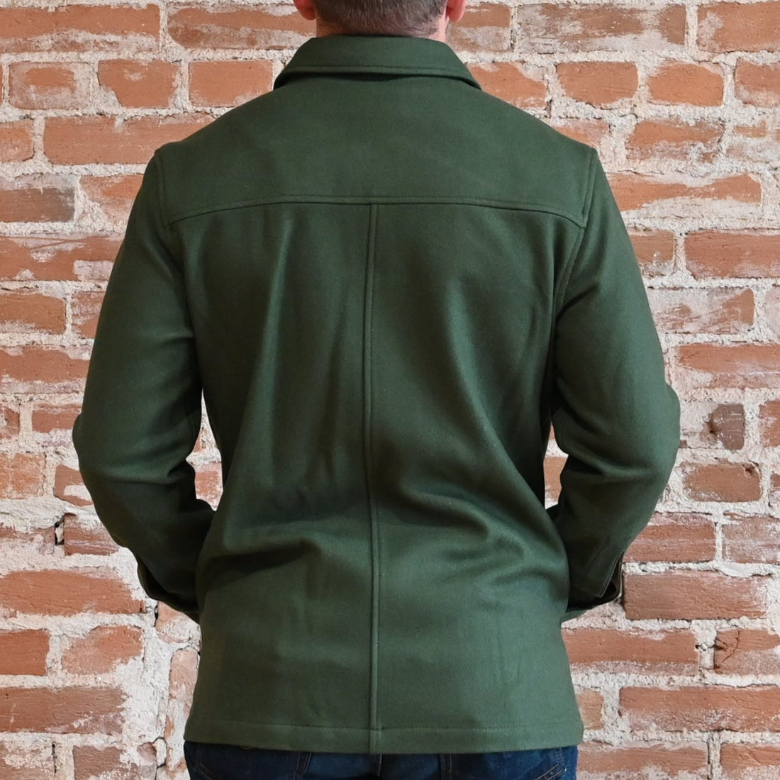 View of Pendleton men’s Lawson wool coat in solid army green with button front and five-pocket design
