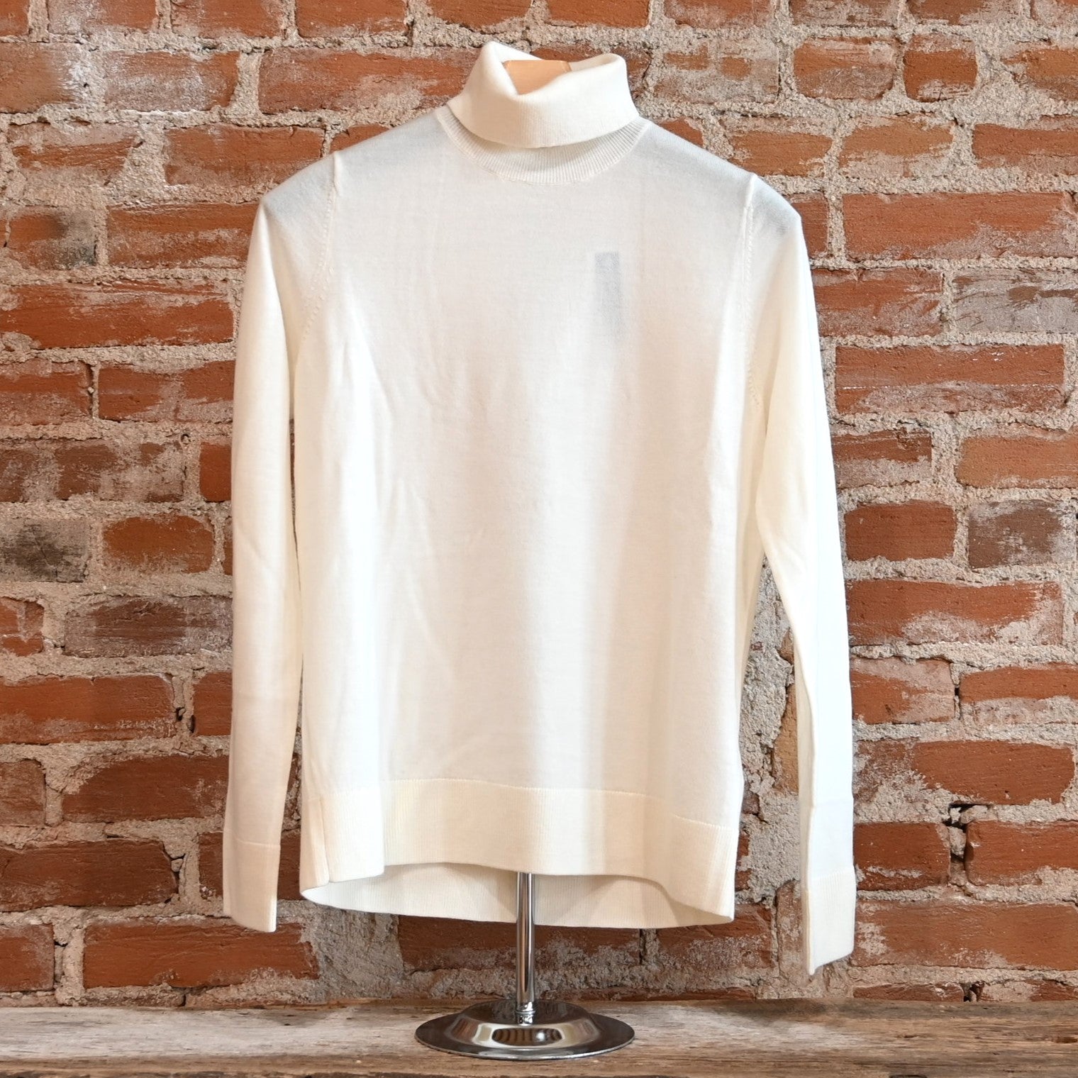 View of Pendleton ladies ivory merino turtleneck sweater with raglan sleeves and ribbed edges