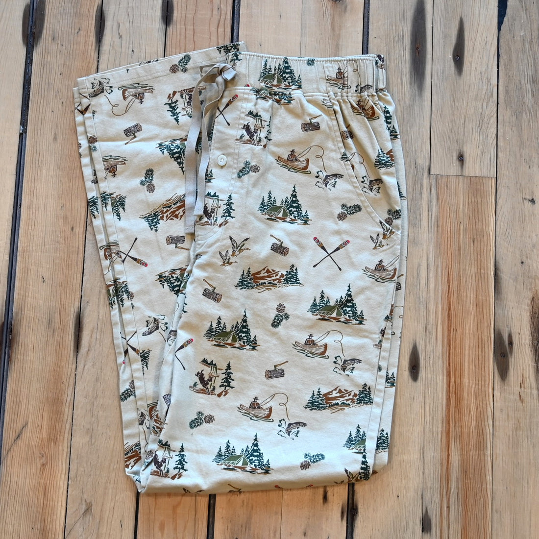 View of Pendleton men’s forest scene flannel pajama pants with tents, deer, and fishing print