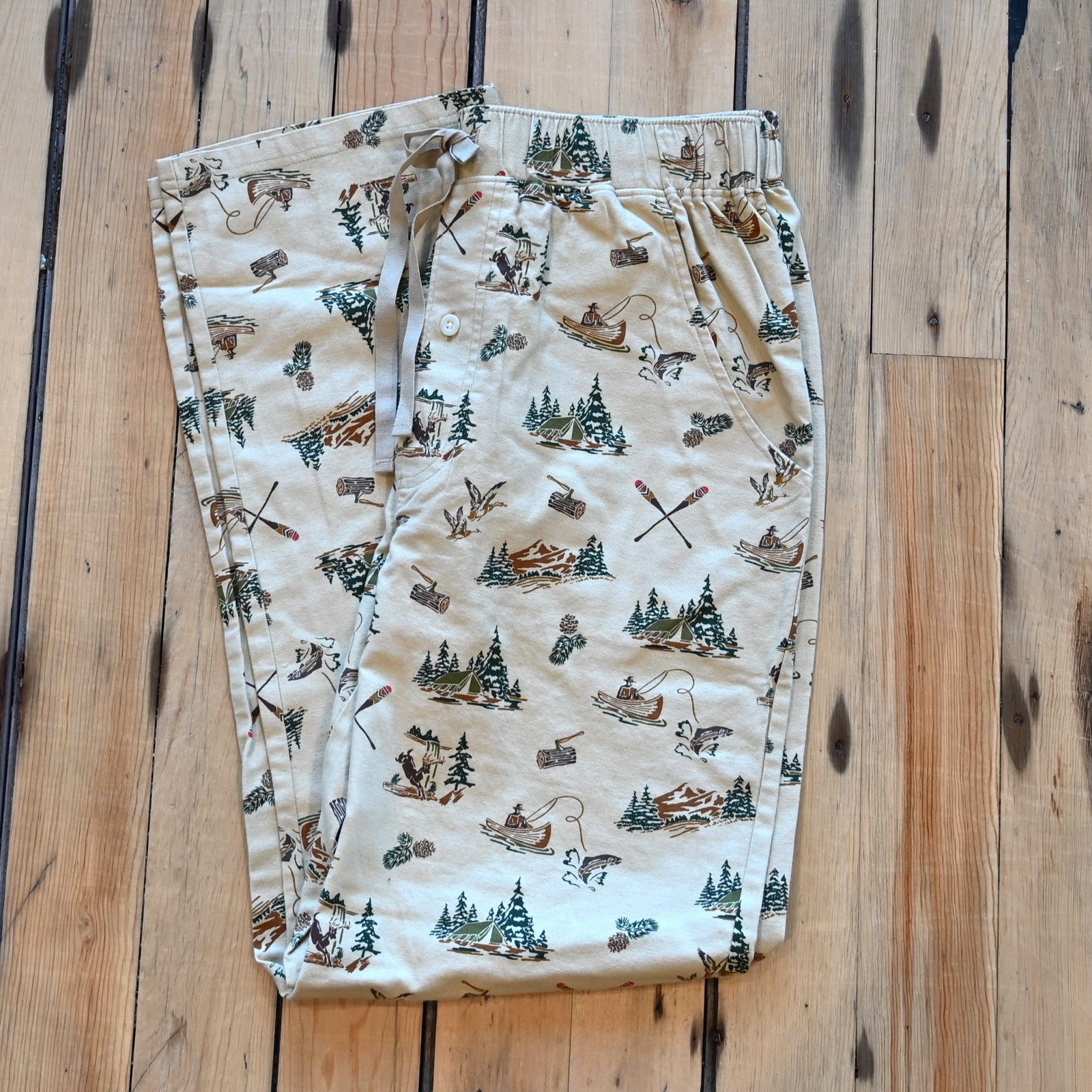 View of Pendleton men’s forest scene flannel pajama pants with tents, deer, and fishing print
