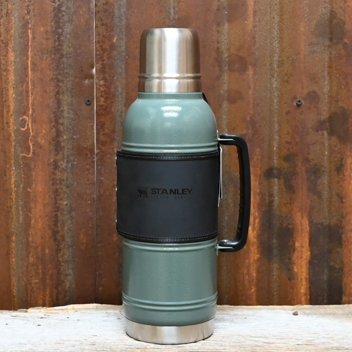 Stanley Legacy QuadVac thermal bottle in hammertone green with wrap and steel cup