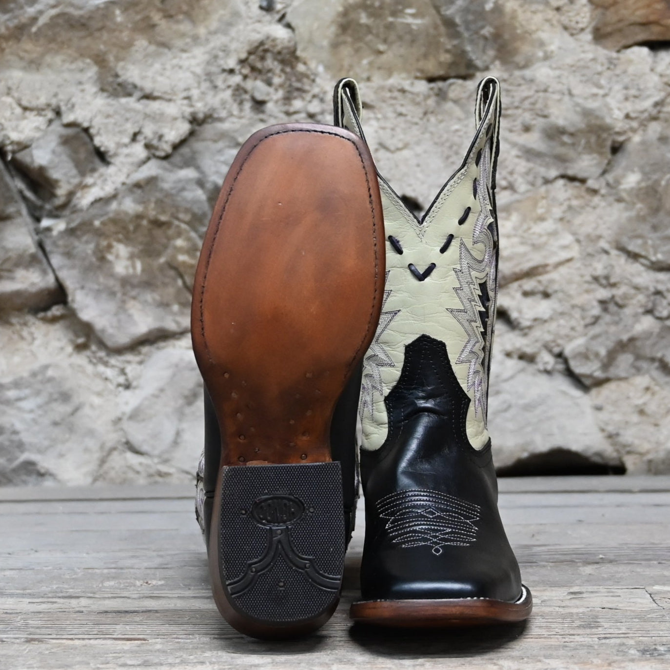 View of Hondo 11" cowboy boot with bone leather top, black steer vamp, and wide square toe