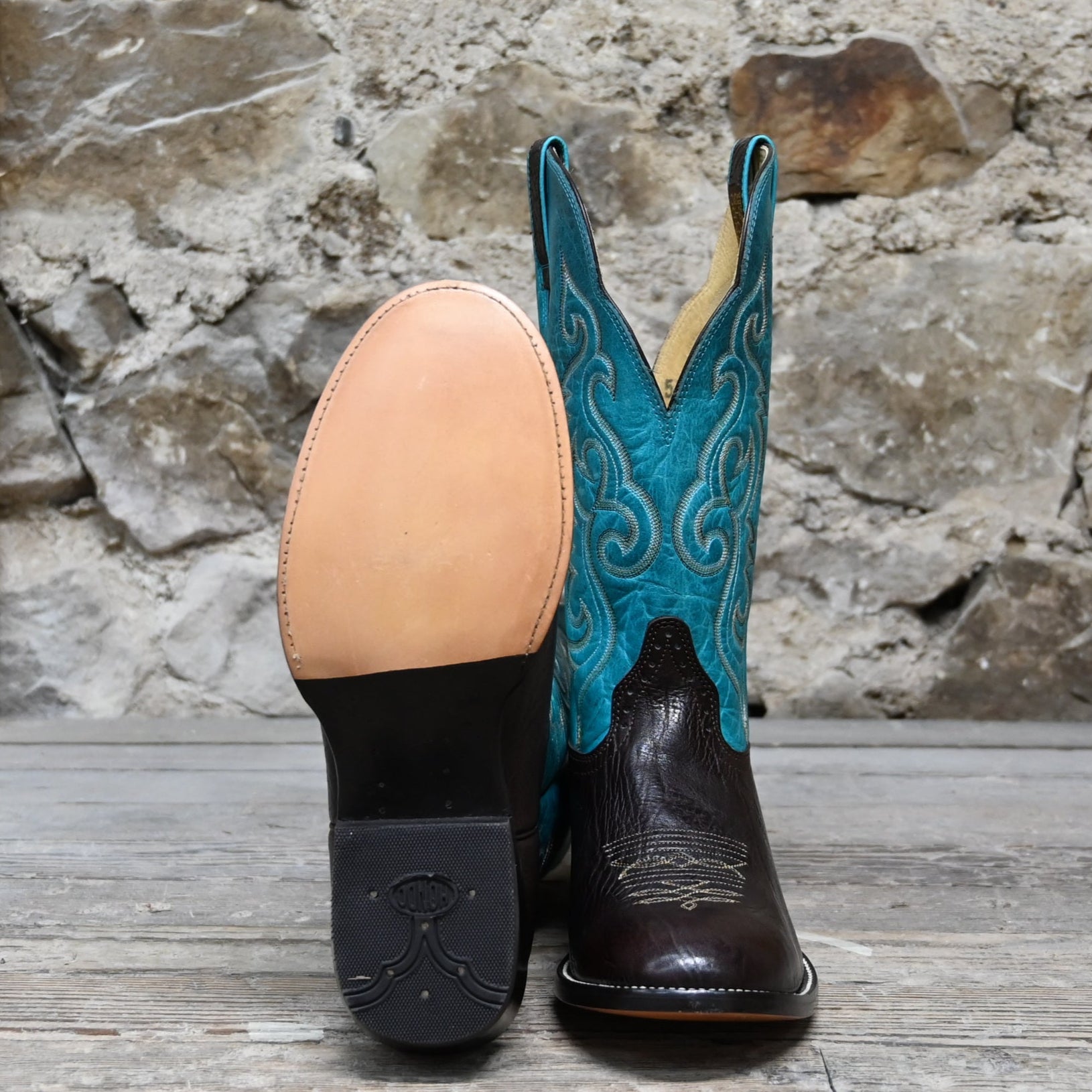 View of Hondo 13" cowboy boot with turquoise top, brown shoulder vamp, wide round toe, and spur ledge