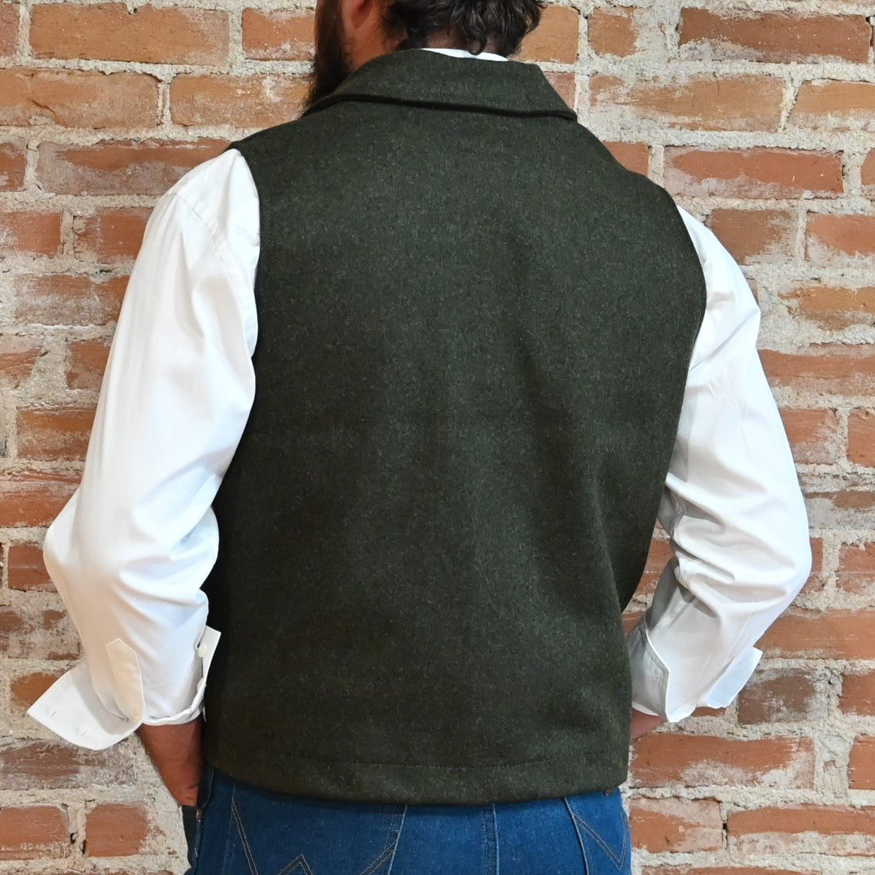 View of Filson Western Vest in Charcoal and Forest Green, showcasing its classic Western design and durable Mackinaw Wool construction