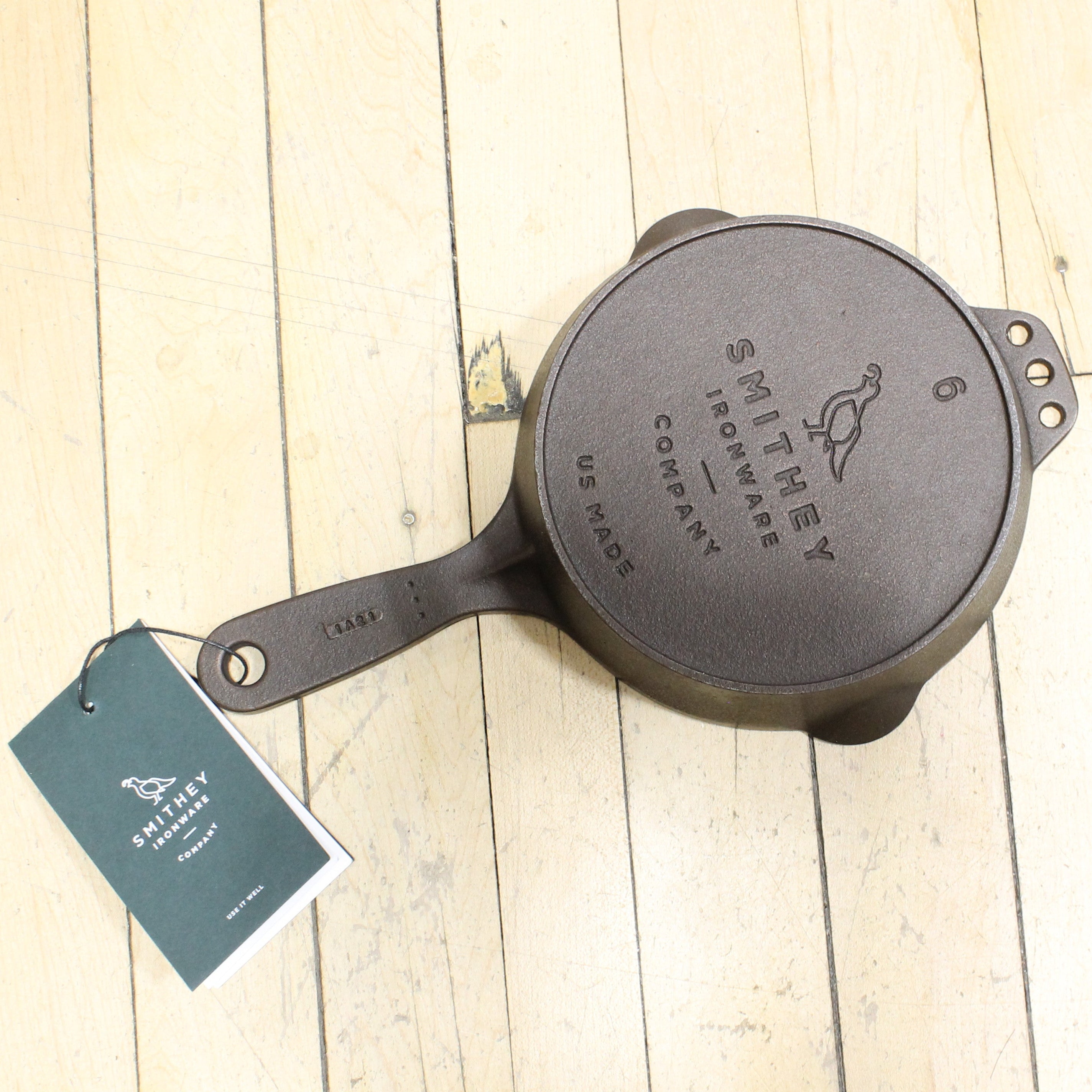 View of Smithey Ironware No. 6 Cast Iron Skillet with polished interior and ergonomic handle