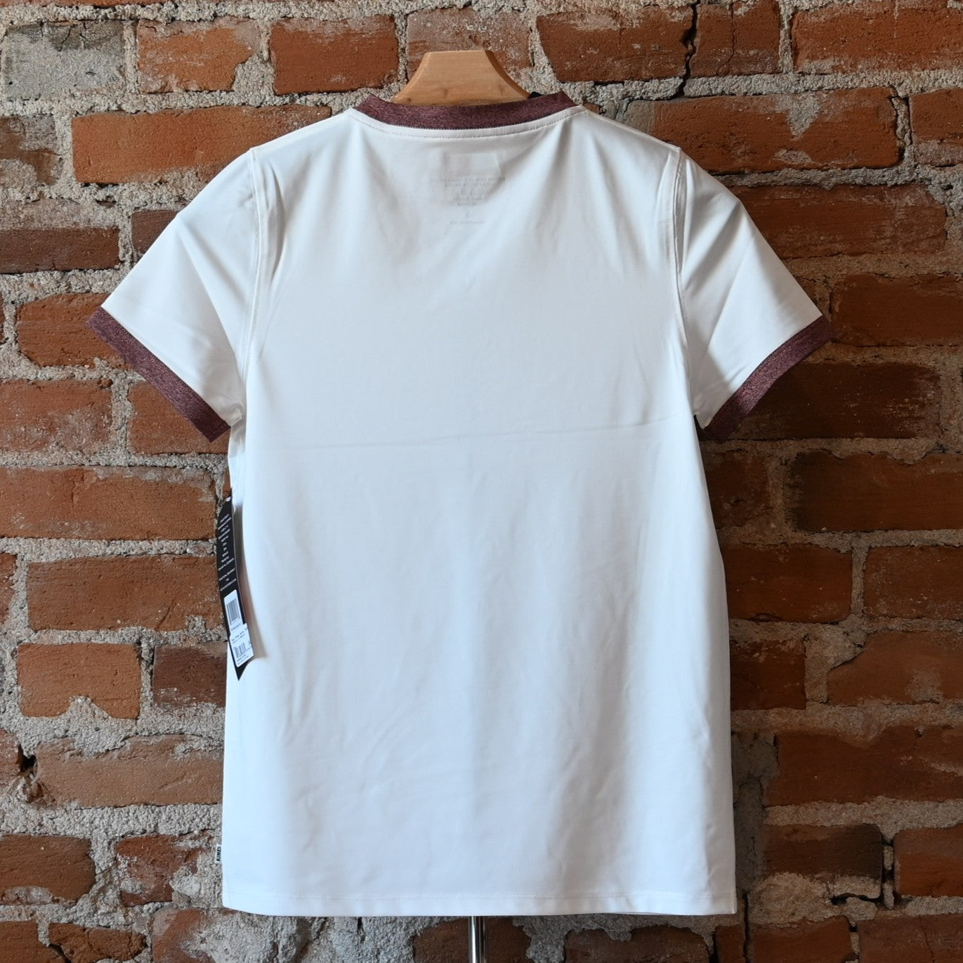 View of Kimes Ranch Ladies Tech T-Shirt in Natural, featuring a straight fit and heat transfer logo