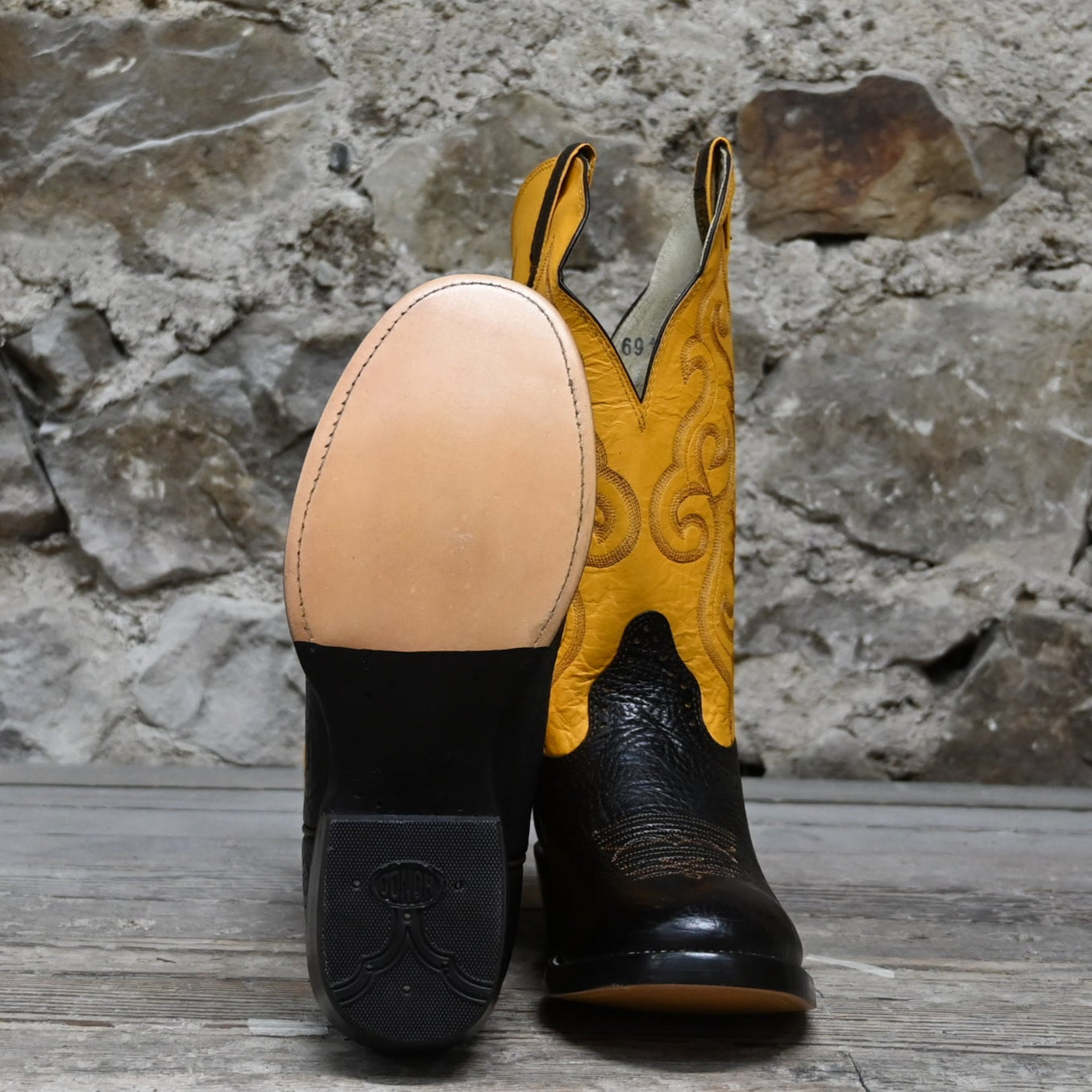 View of Hondo 13" cowboy boot with yellow top, brown shoulder vamp, and wide round toe