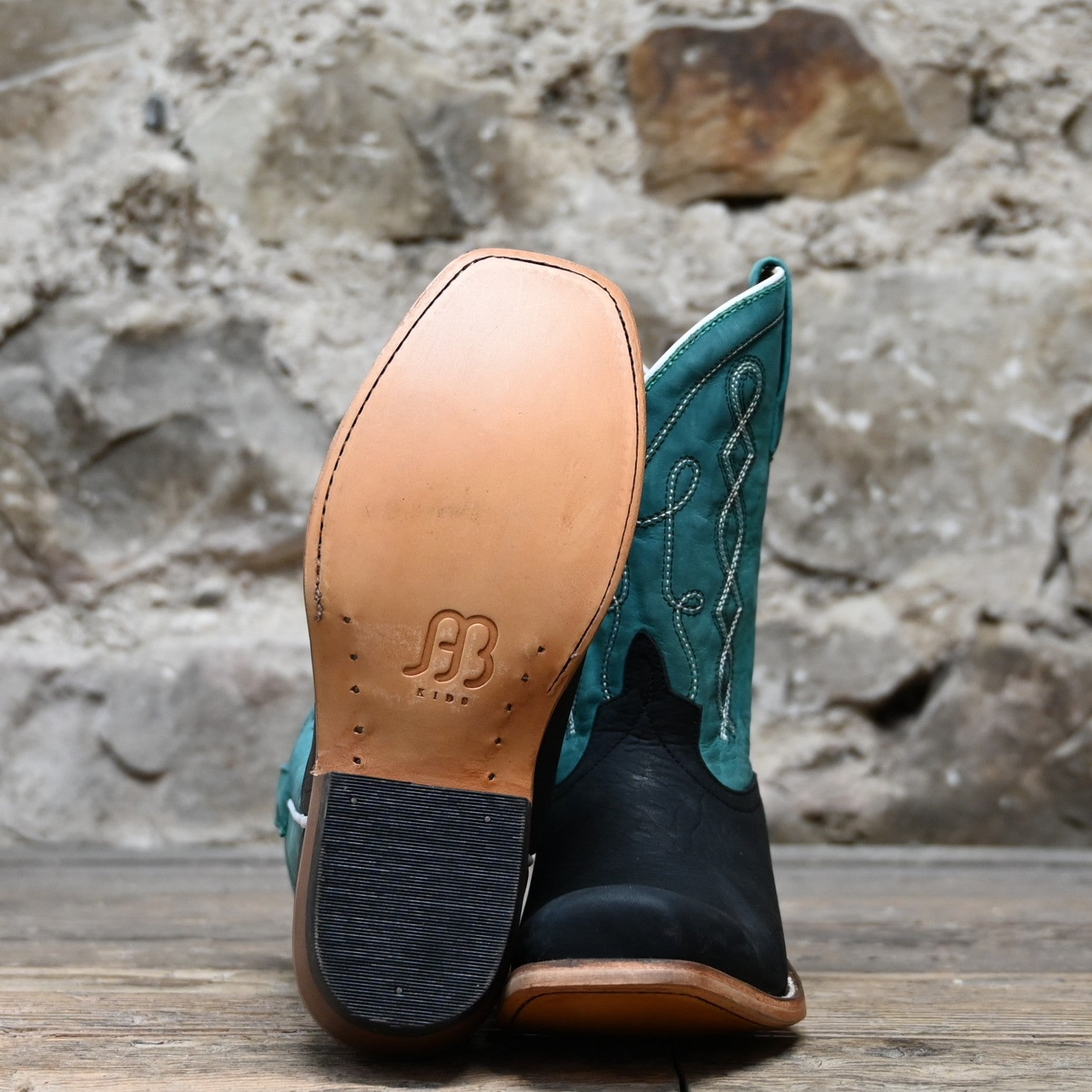 View of Anderson Bean Kids cowboy boot with black oiled shoulder vamp and sea foam leather top