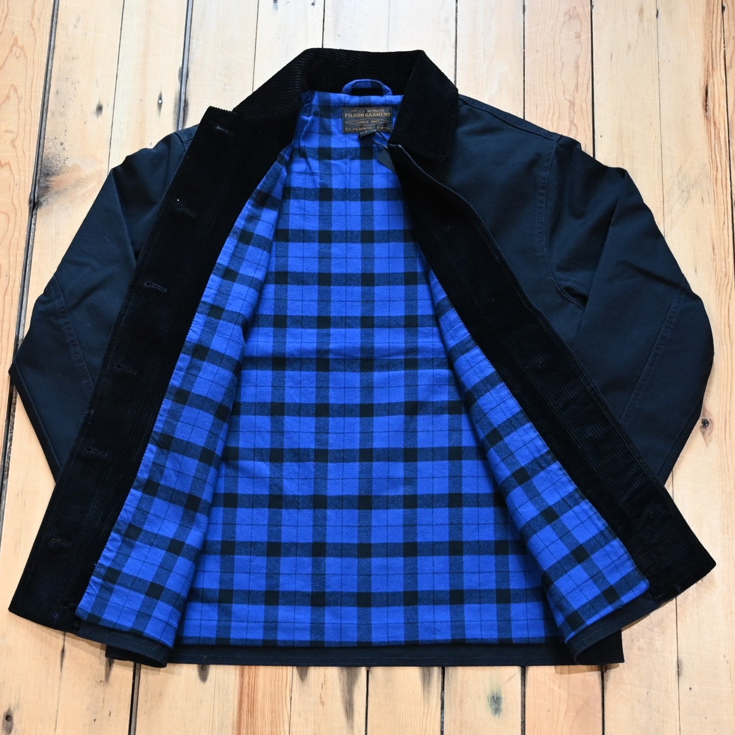 Filson women’s barn coat in navy canvas with corduroy collar and patch pockets