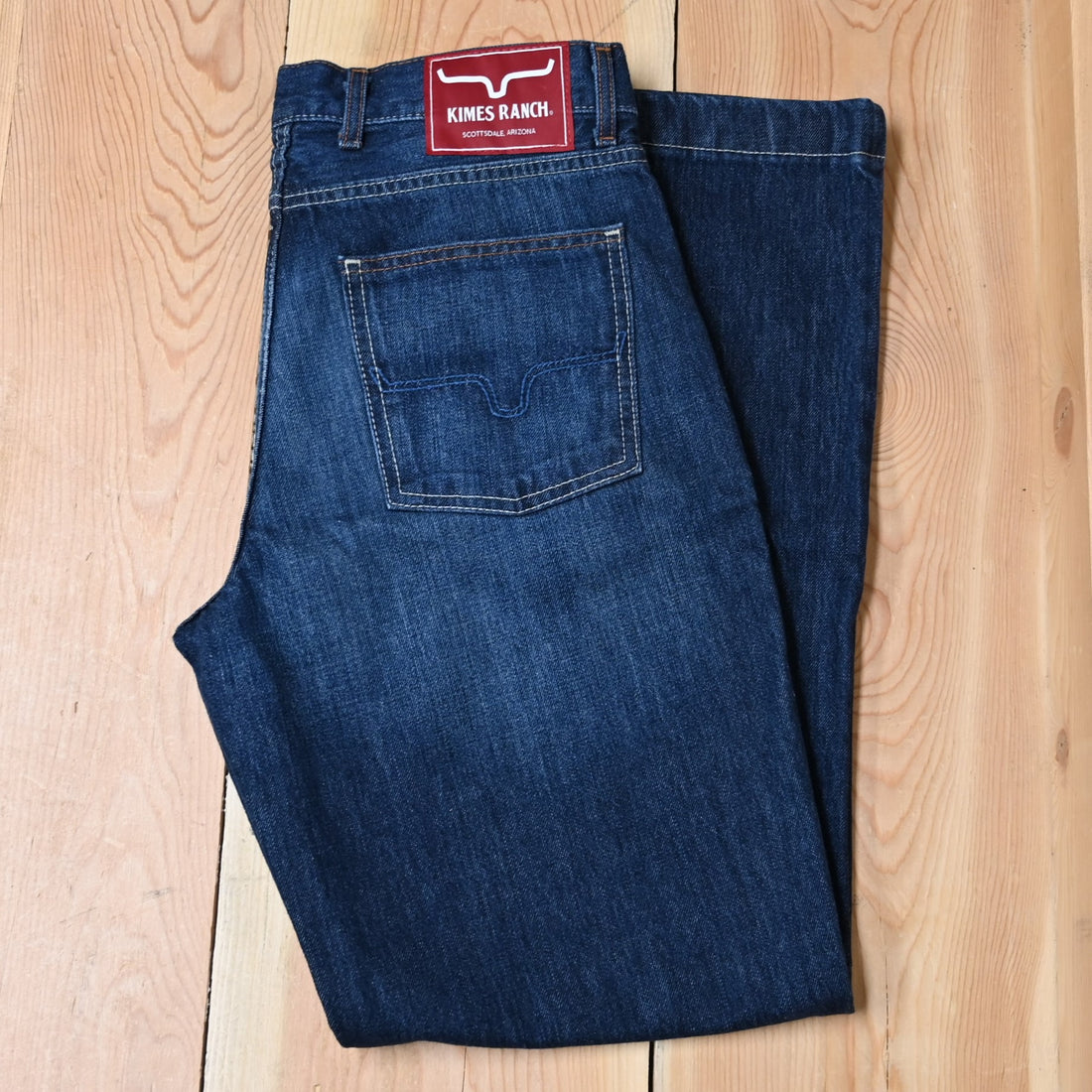View of Kimes Ranch Dillon Jeans in Blue, featuring a mid-low rise, relaxed upper thigh, and wide bootcut leg with hand-sanded details
