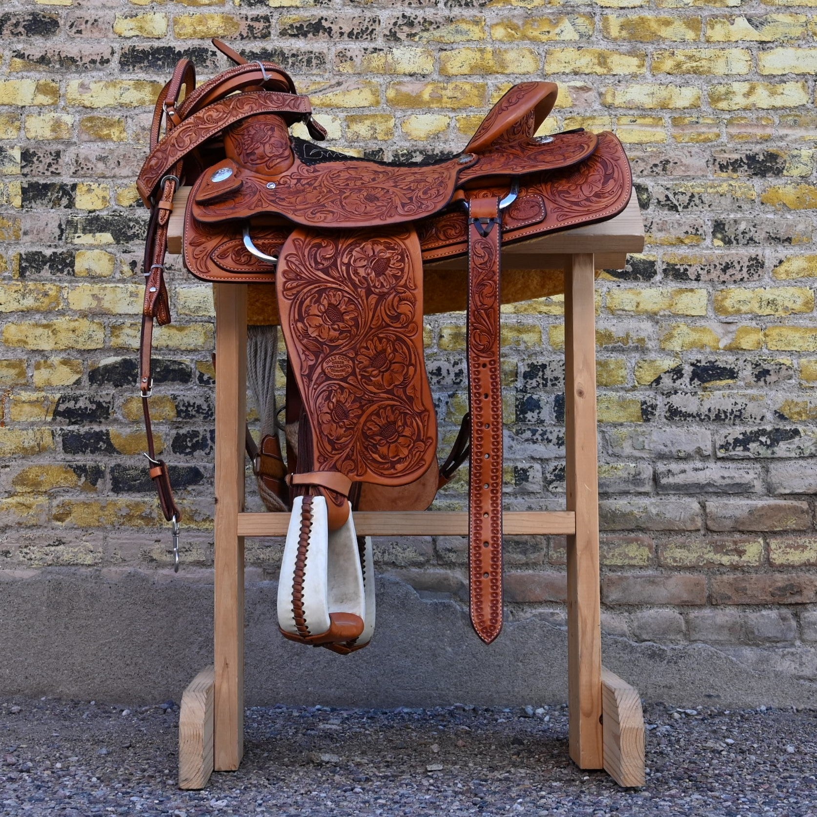 View of Billy Cook Fully Tooled Roper Saddle with Bridle, Breast Collar, and Reins