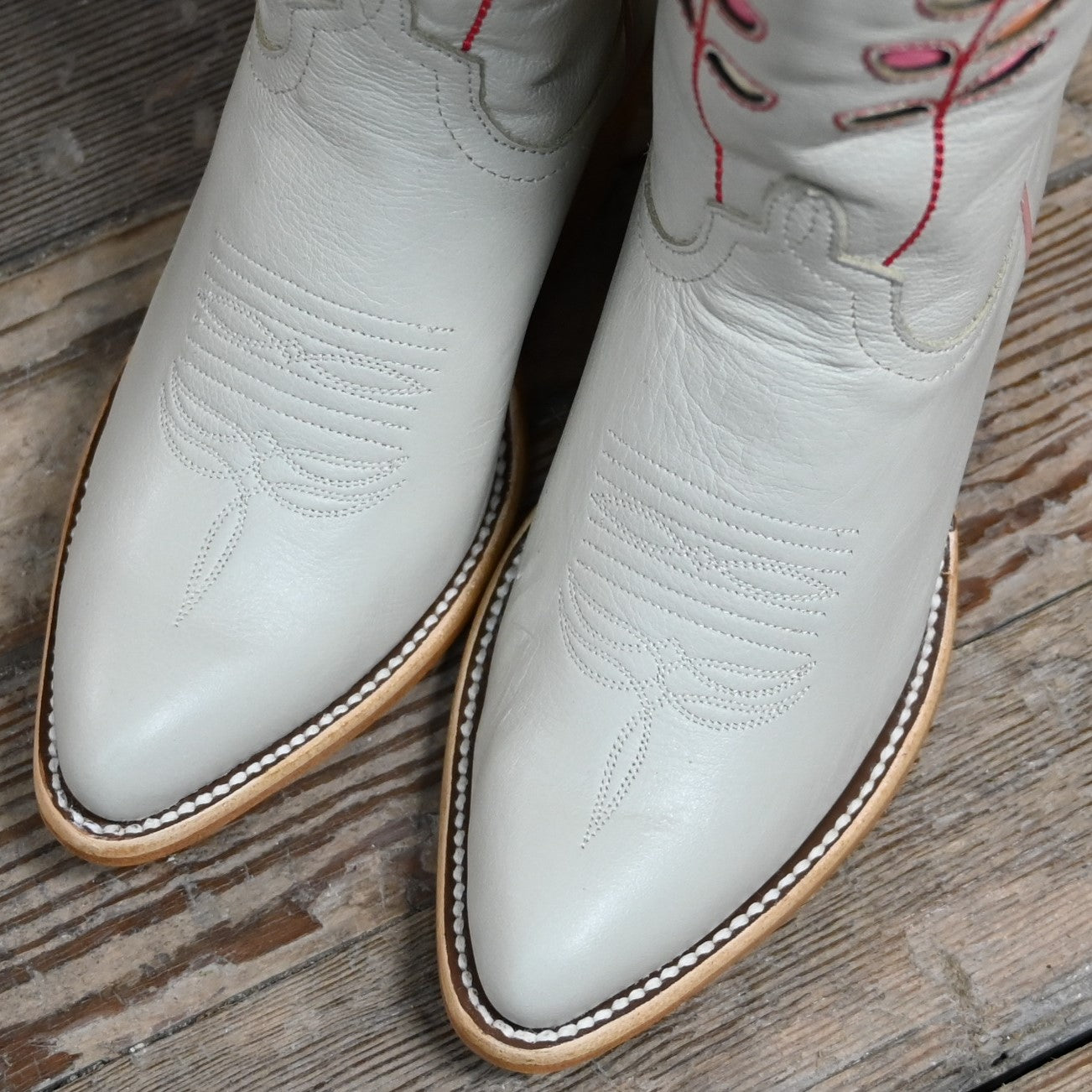 View of Macie Bean 15″ Cream Hotshot boot with almond vamp and citrus inlay shaft