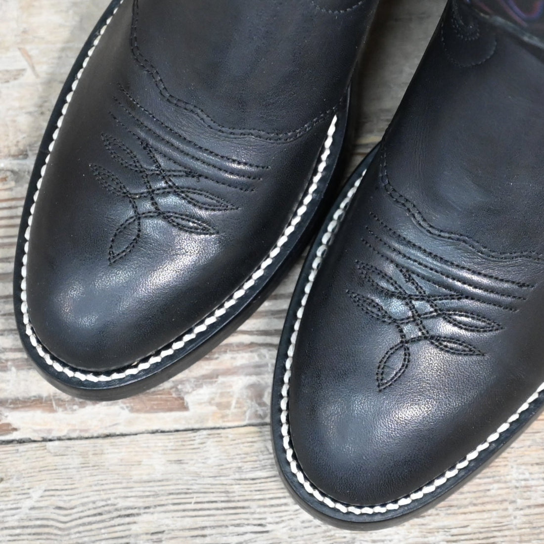 View of Hondo 14" cowboy boot in black retan leather with pull holes, spur ledge, and medium round toe