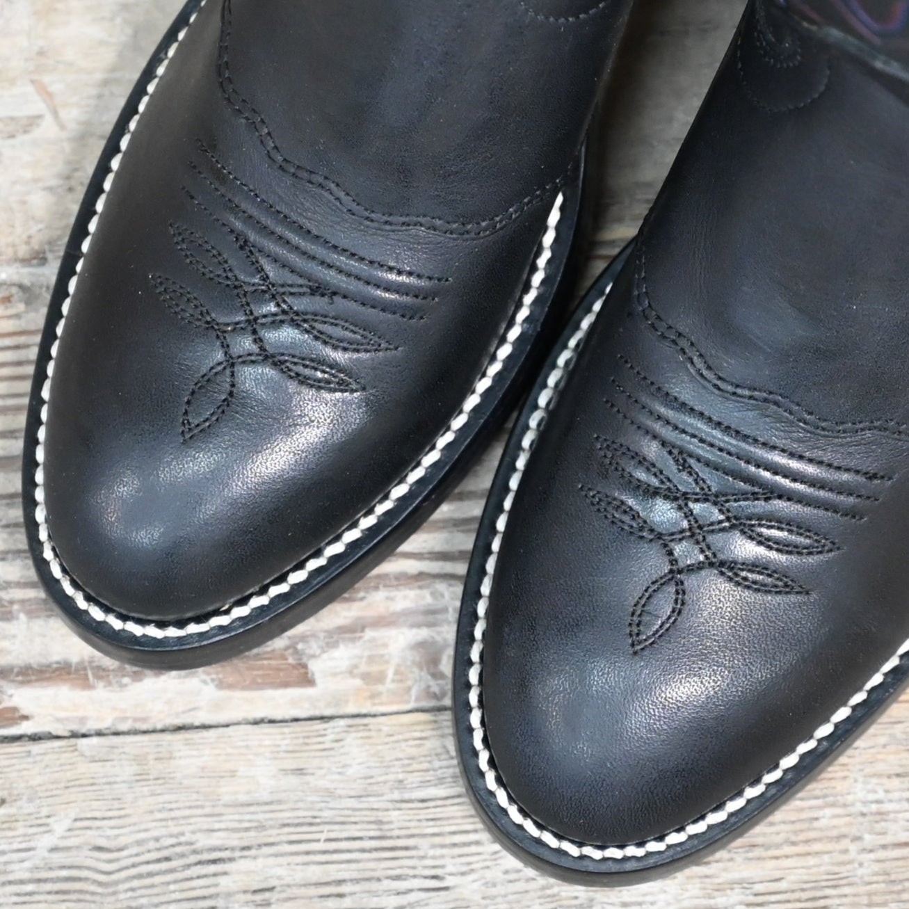 View of Hondo 14" cowboy boot in black retan leather with pull holes, spur ledge, and medium round toe