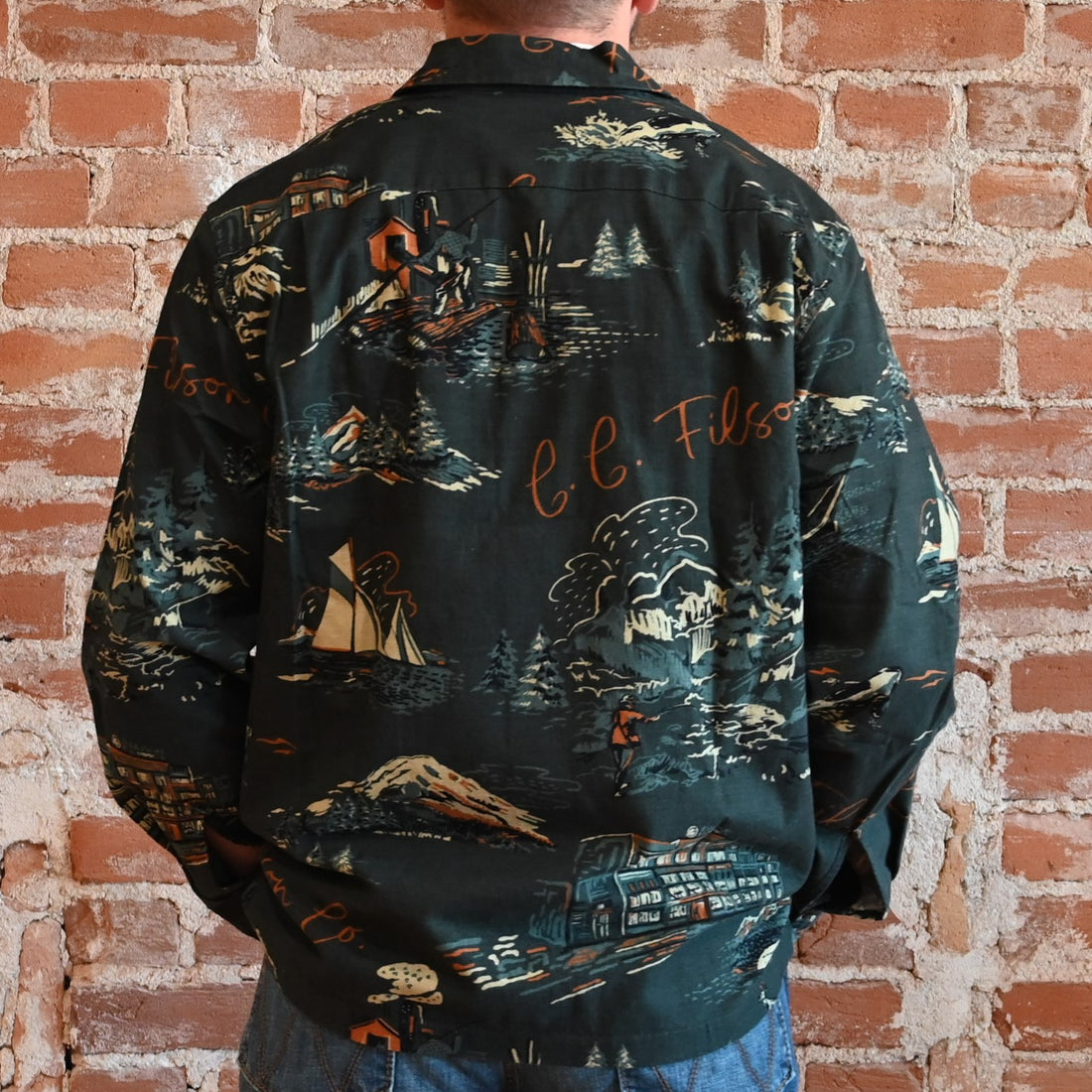 View of Filson Elk Heights Camp Shirt in Green NW Scenes and Blue/Black Khaki featuring unstructured camp collar and button-secured chest pockets