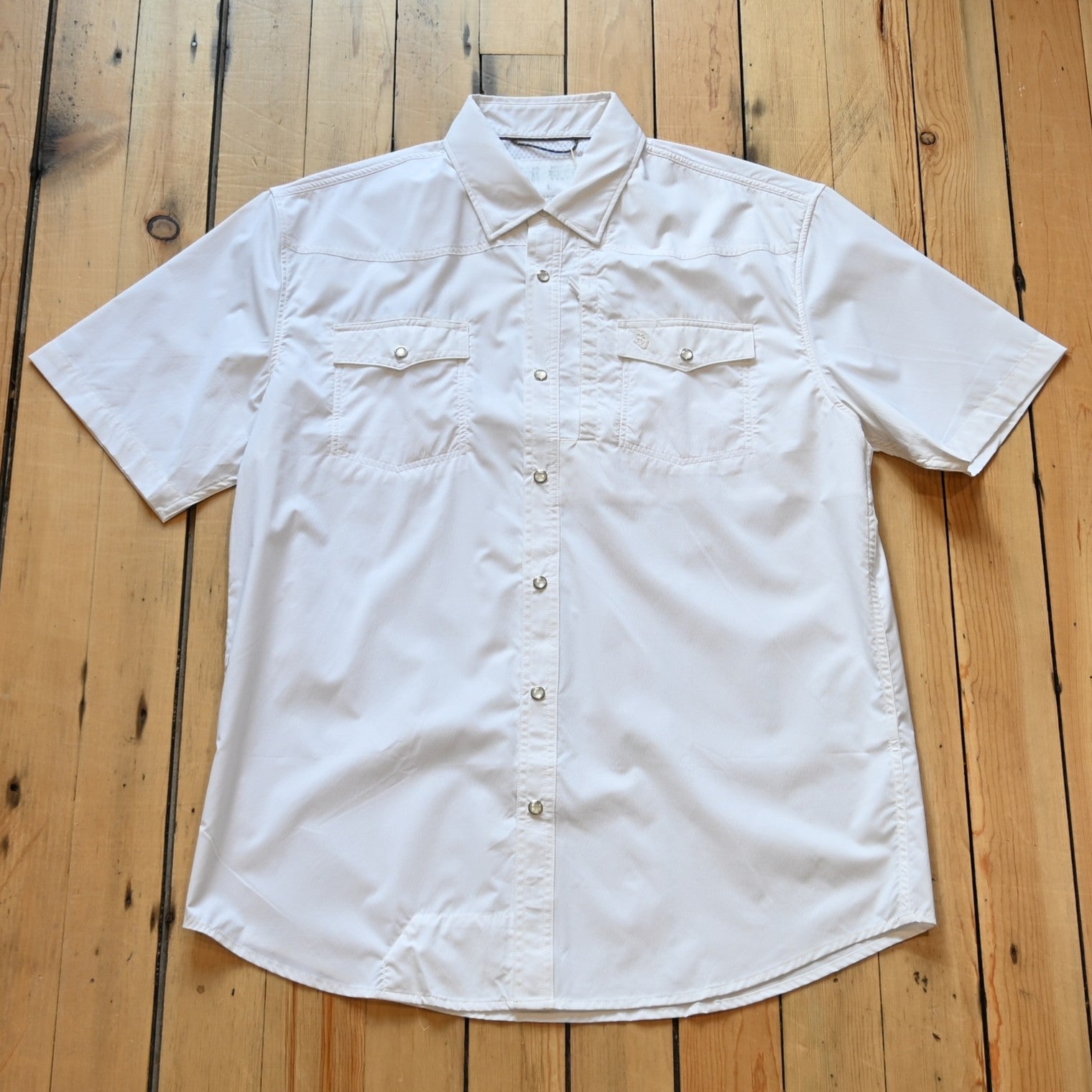 View of White short sleeve RangeTek Western snap shirt with mesh ventilation and security pocket