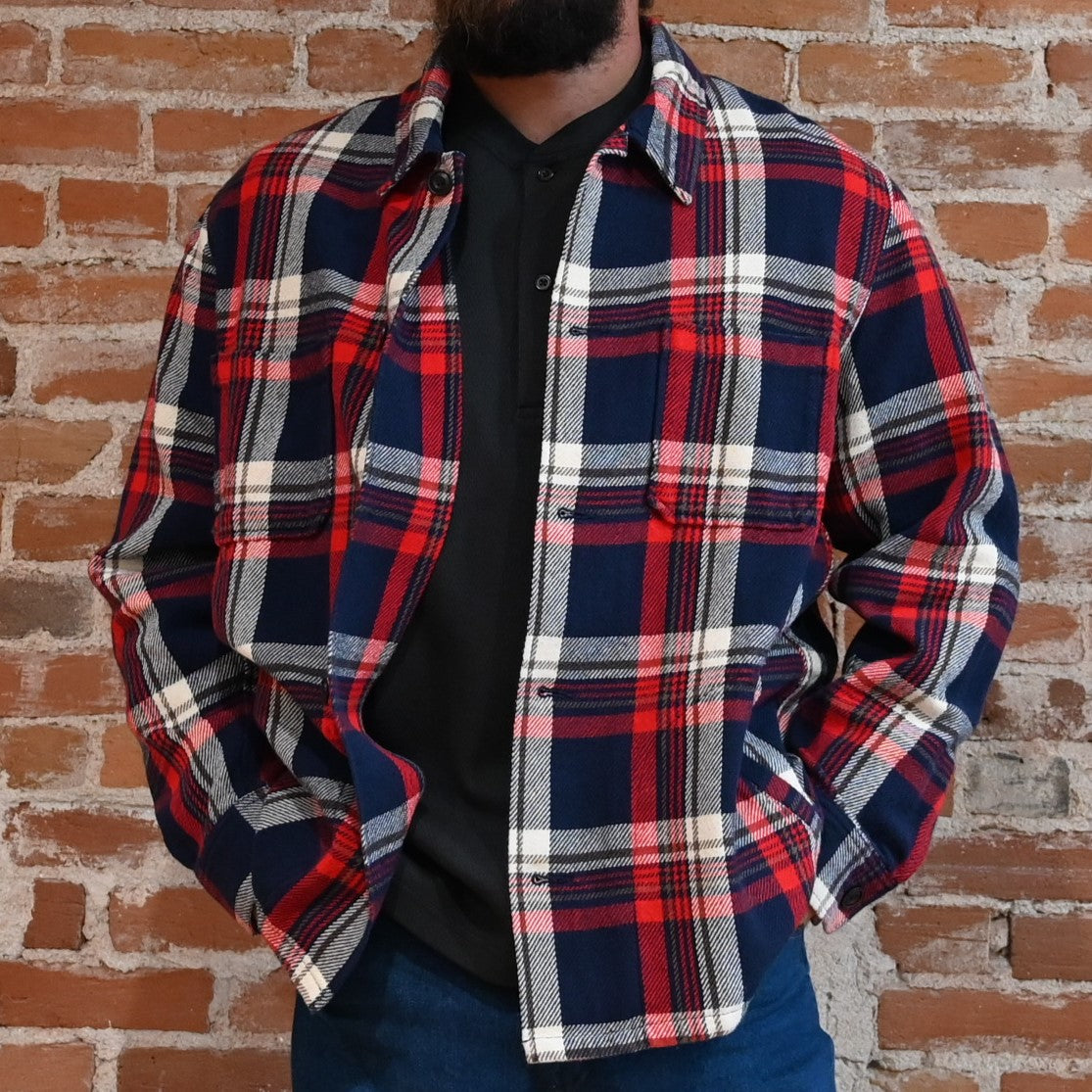 View of Filson Deer Island Ranch Coat in Navy/Red Multi Plaid and Dark Tan/Sycamore Plaid featuring button-front closure and patch pockets