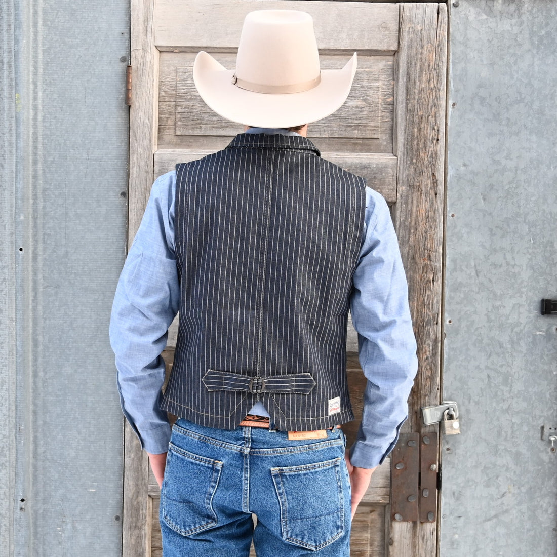 View of Blue Blanket men’s dark indigo denim vest with vertical stripes and button front