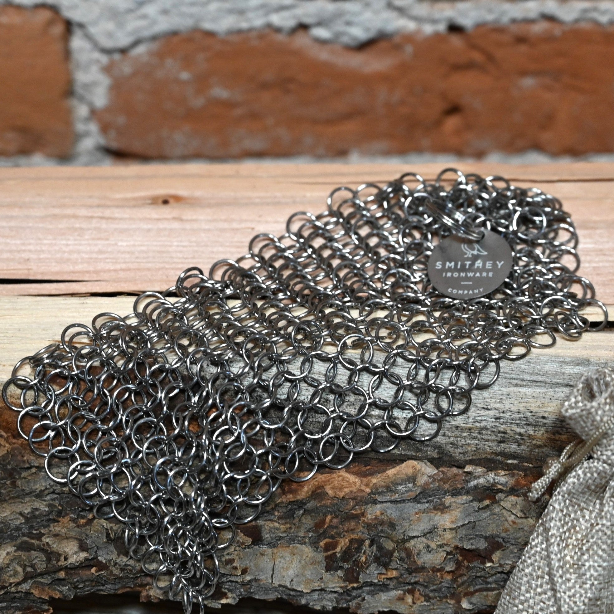 View of Smithey Ironware 5x5 Stainless Steel Chainmail Scrubber for cleaning cast iron cookware