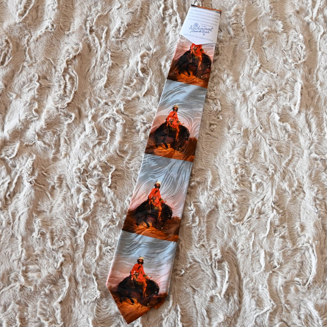 View of Silk necktie with mountain man illustration and pine tree motif by Rockmount