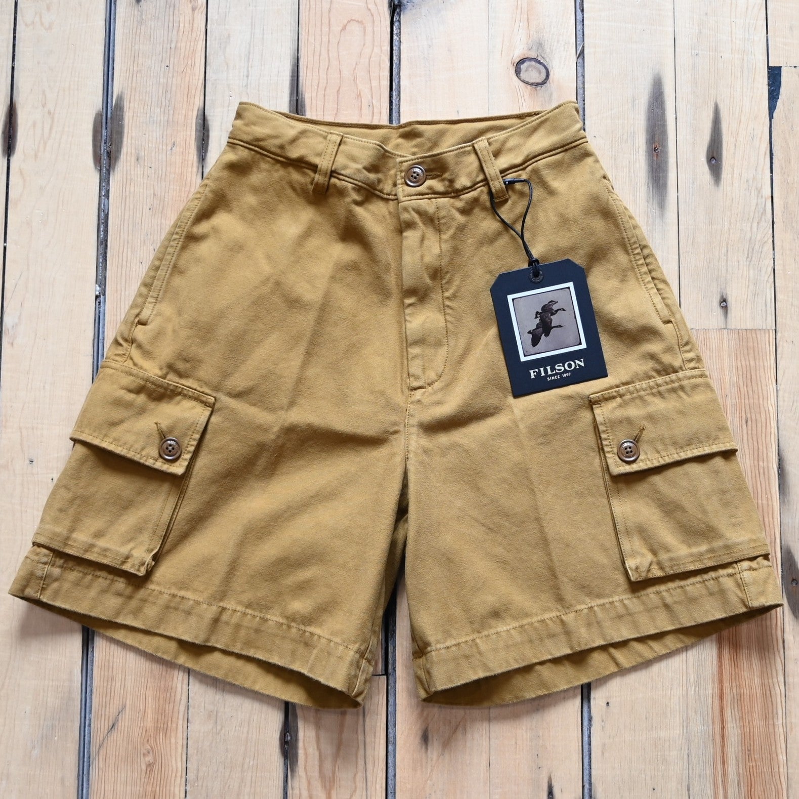 View of Filson Ladies Field Camp Shorts in Dark Ochre featuring button-flap cargo pockets and tailored fit