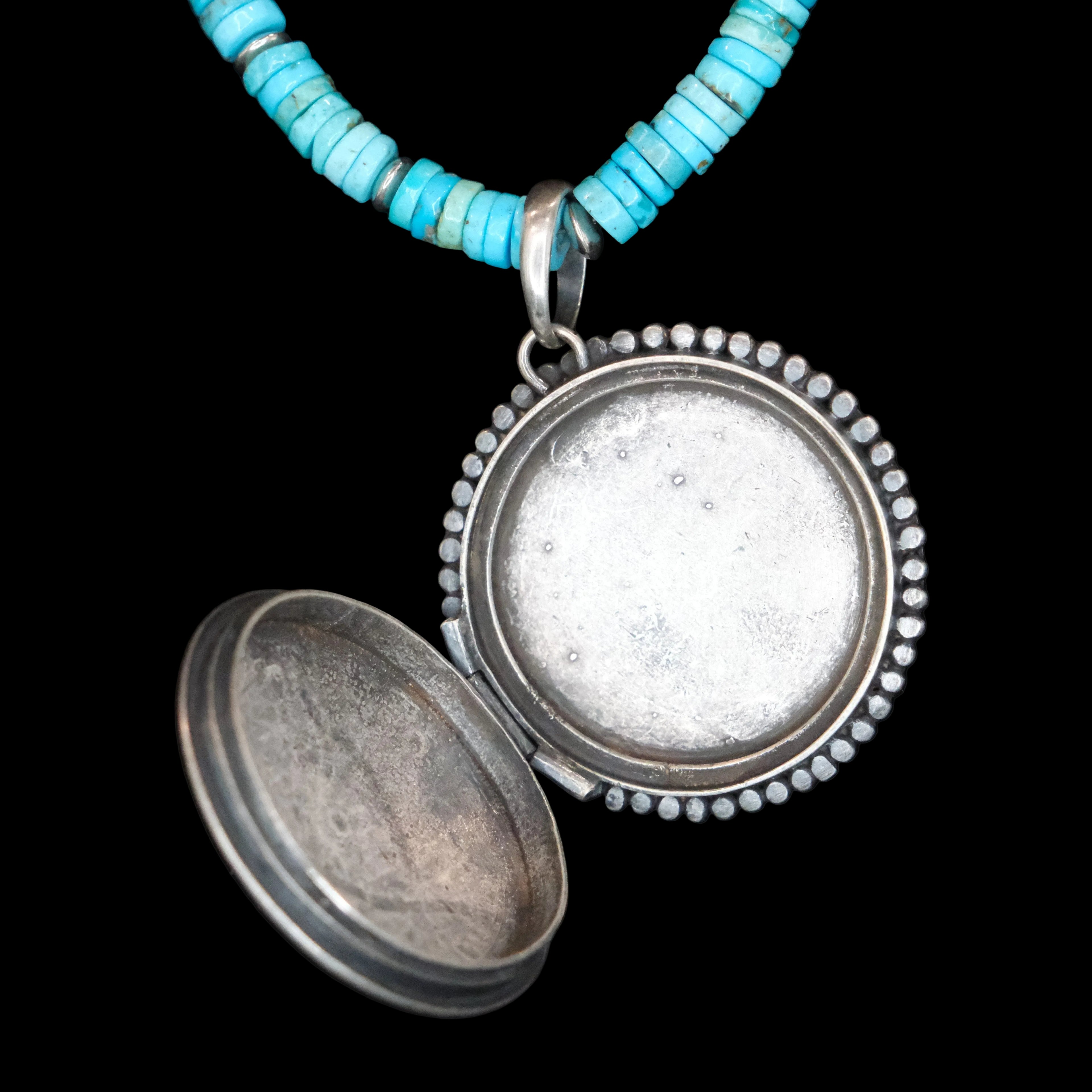 Peyote Bird turquoise beaded necklace with silver and turquoise locket displayed on black bust