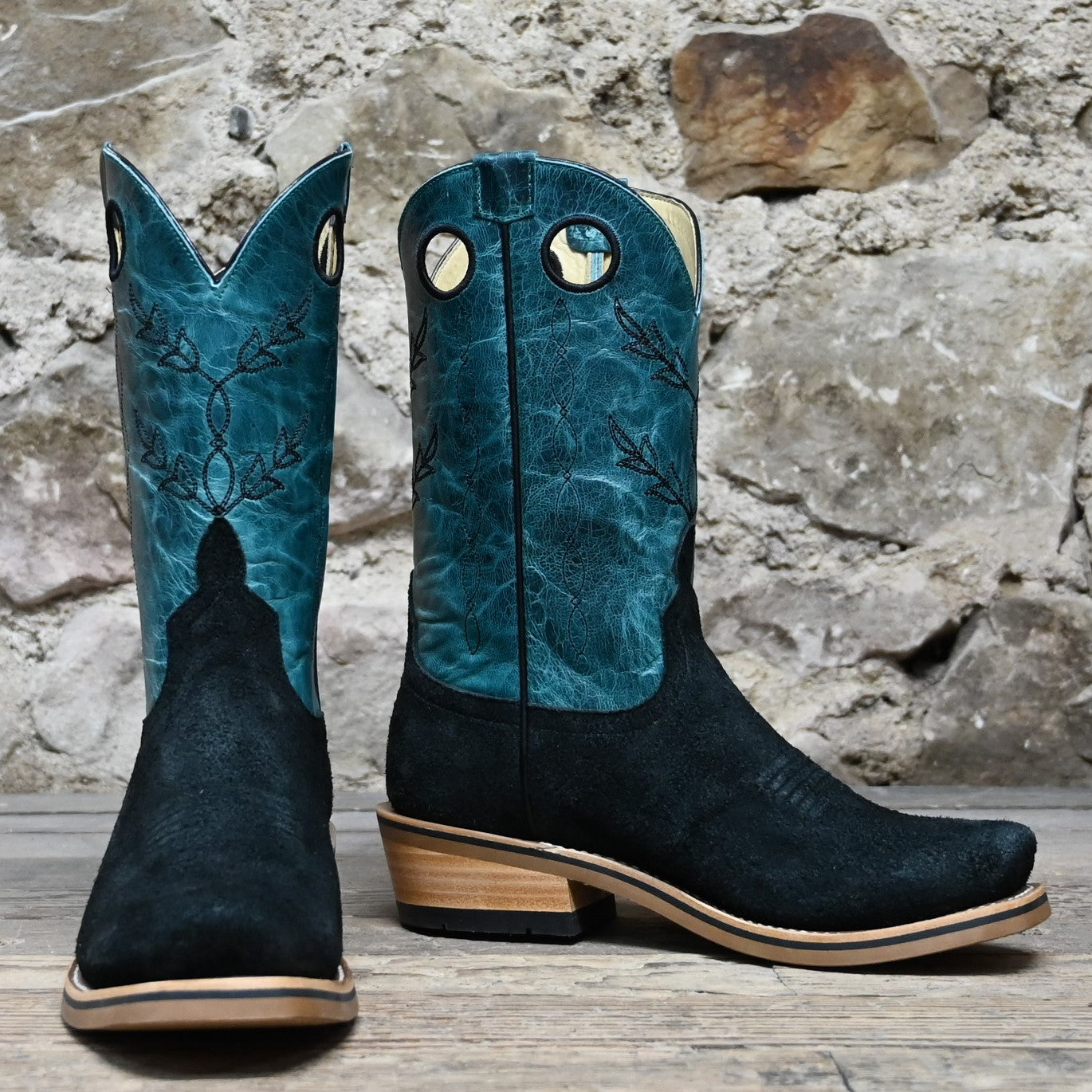 View of Horse Power 11" boot with black suede vamp, blue volcano shank and top, cutter toe, and pull holes