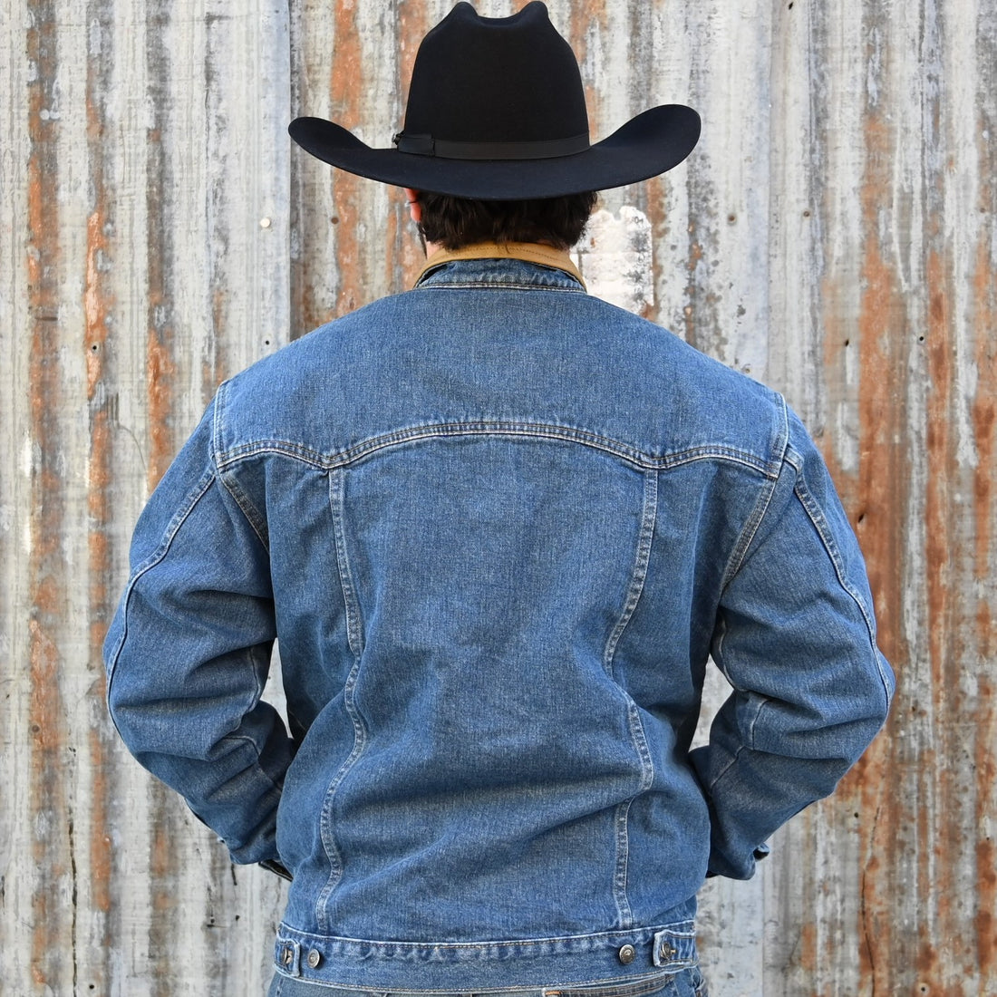 View of Schaefer unlined denim jackets in Indigo, Saddle, Tan, Olive, and Natural with Western yoke and four-pocket front