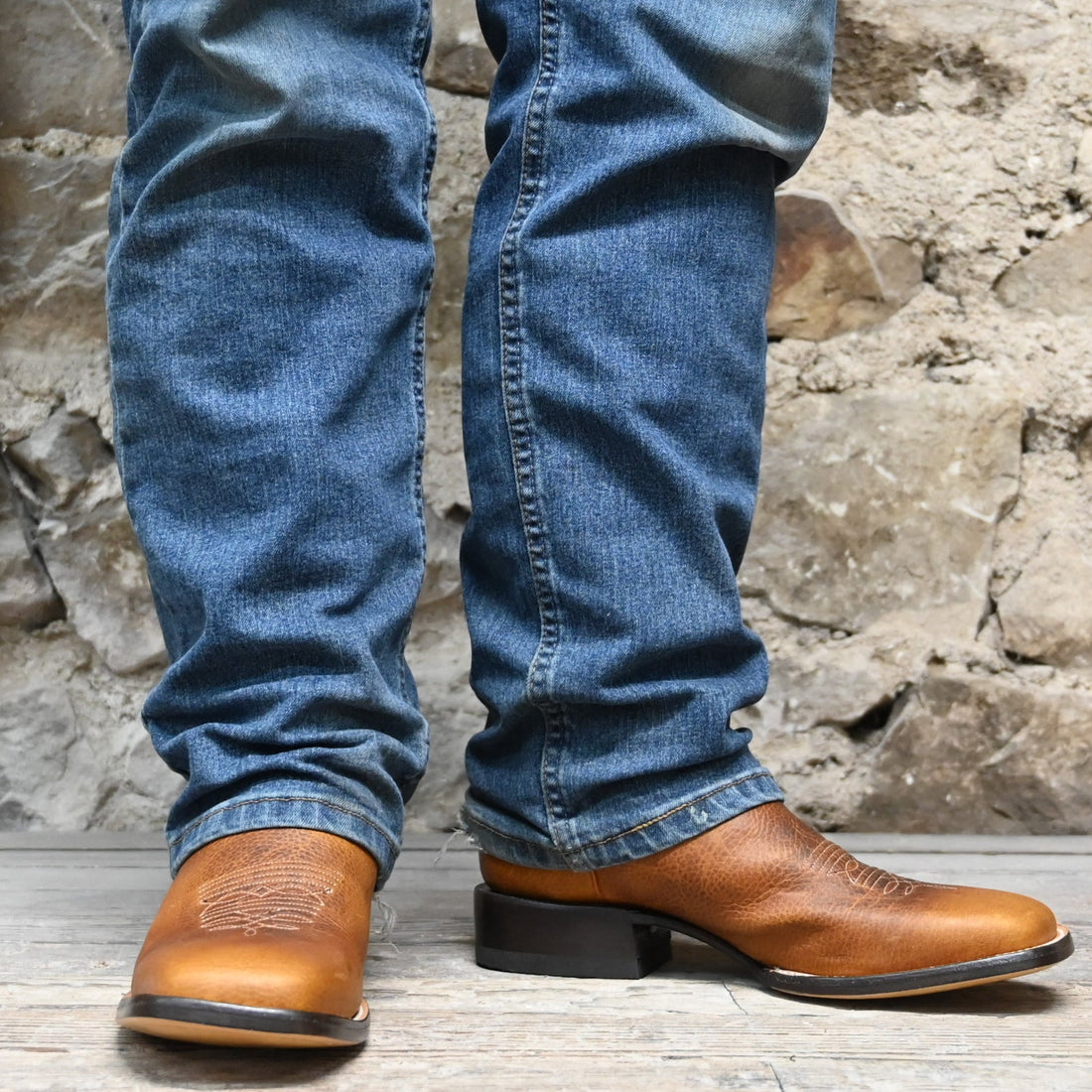 View of Hondo 13" cowboy boot with red volcano top, rust oil tan vamp, wide square toe, and spur ledge
