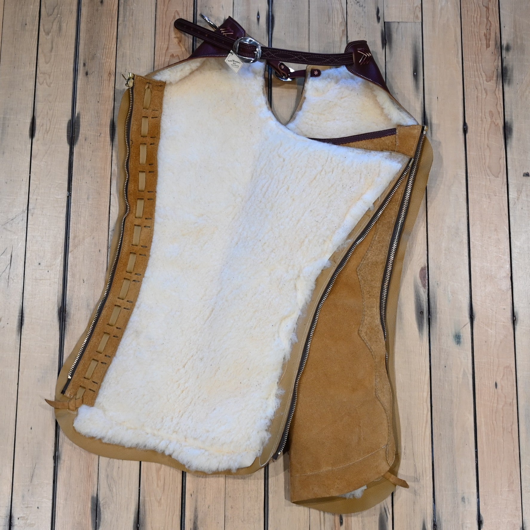 Rockin’ Y Saddlery rough-out leather Arizona work chaps with fleece lining, zipper closure, ring belt, and front pocket