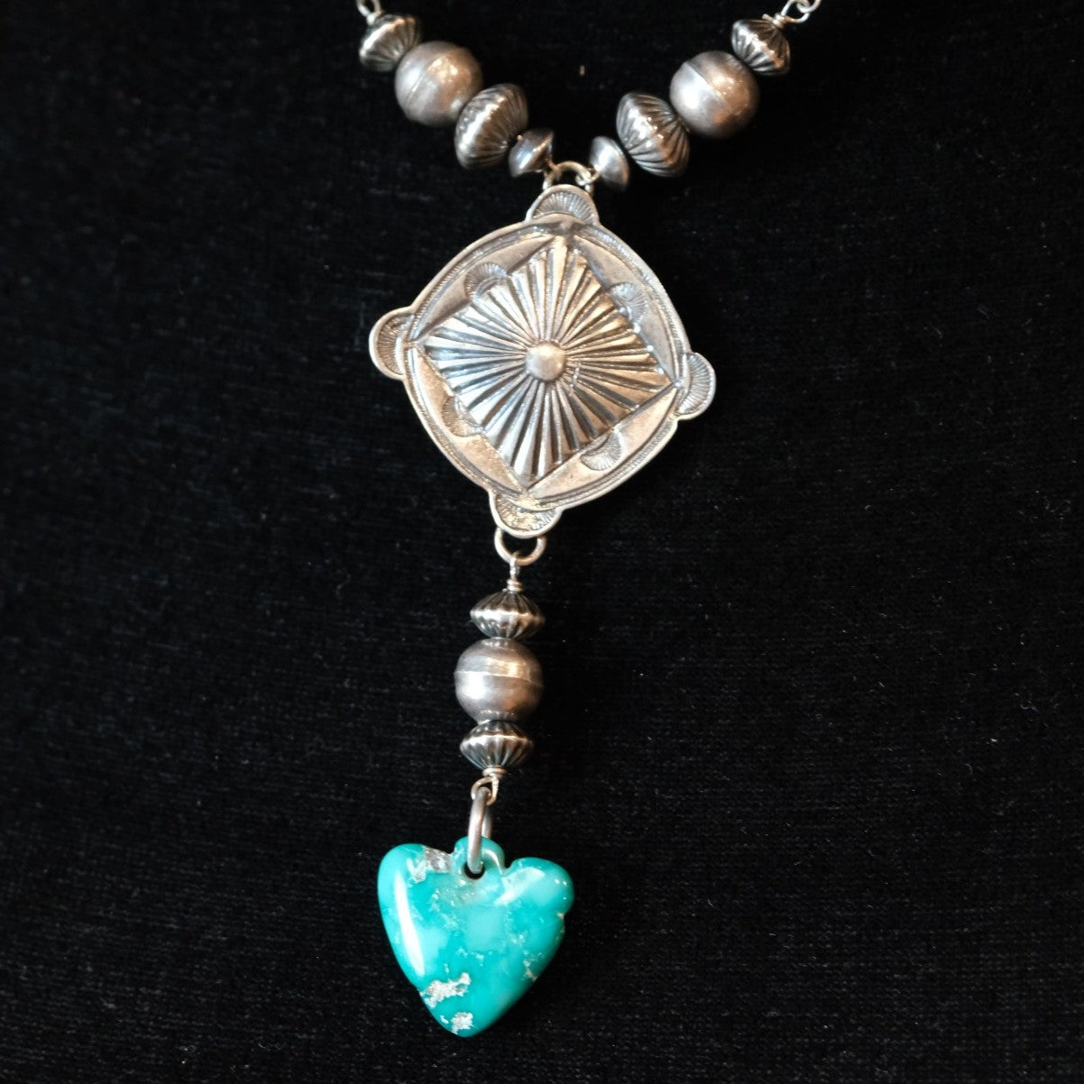 Peyote Bird Revival Heartwell Concho Y Necklace with silver beads and a turquoise heart.