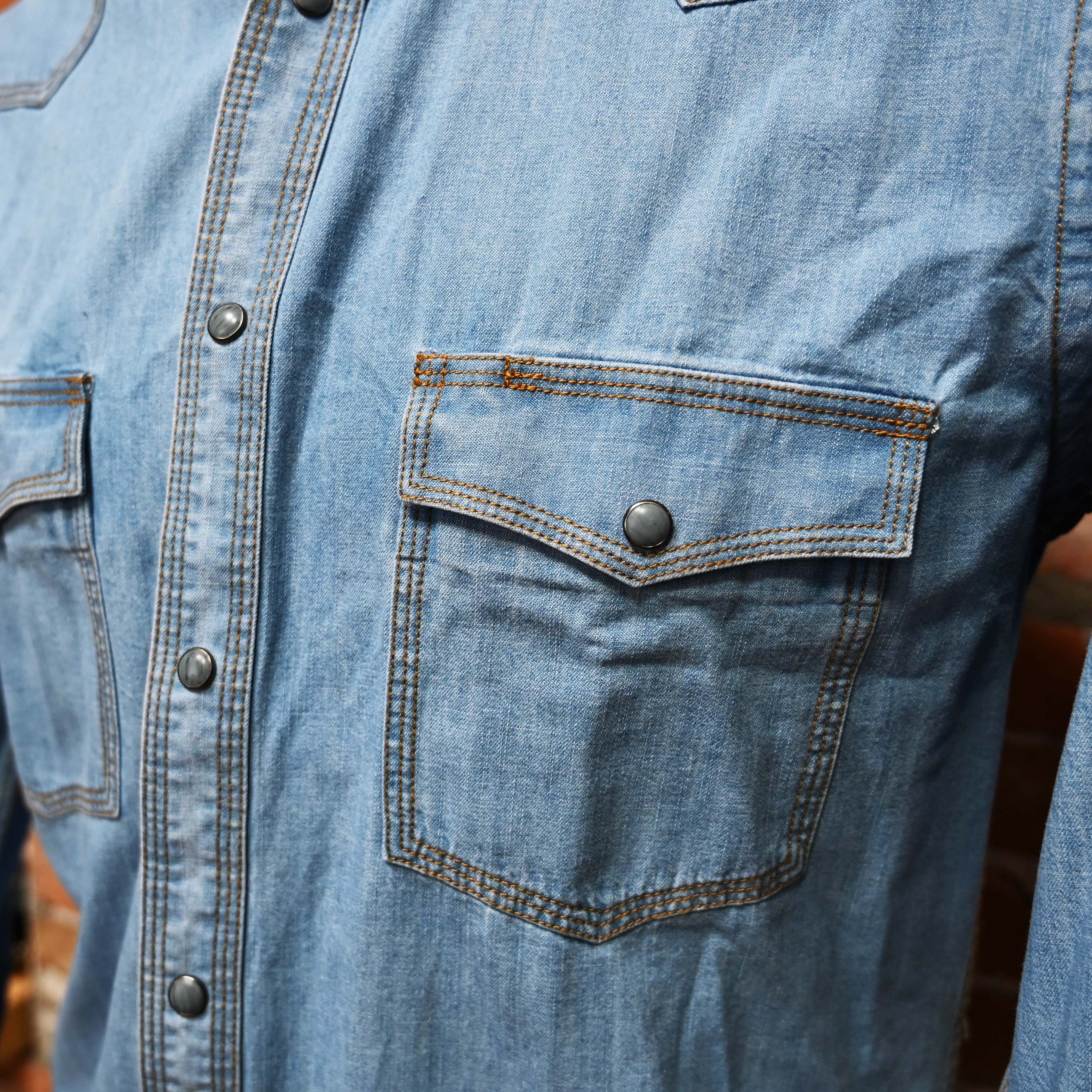 View of Indigo or blue Schaefer Classic Abilene western snap shirt with pumpkin stitching and pearl snaps