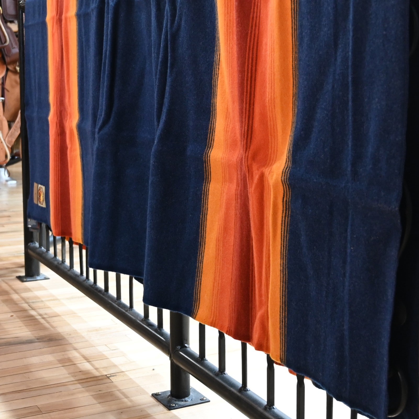 View of Pendleton National Park Blanket in Grand Canyon Navy with heritage stripes and park label