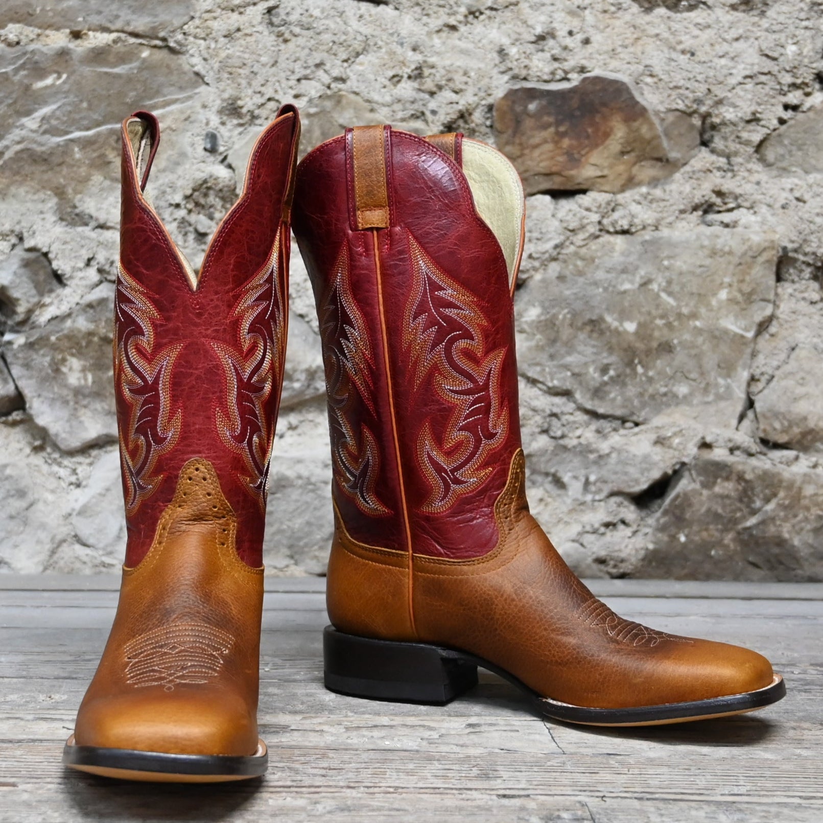 View of Hondo 13" cowboy boot with red volcano top, rust oil tan vamp, wide square toe, and spur ledge