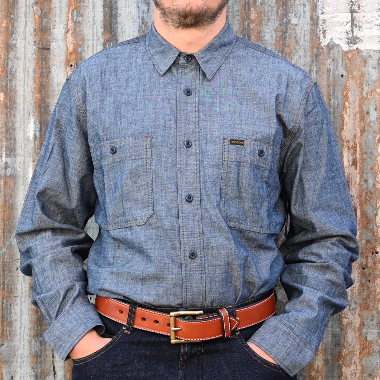 View of Filson Chambray CPO Shirt in Rinsed Indigo and Light Indigo featuring button-secure chest pockets and knife pleats for enhanced mobility