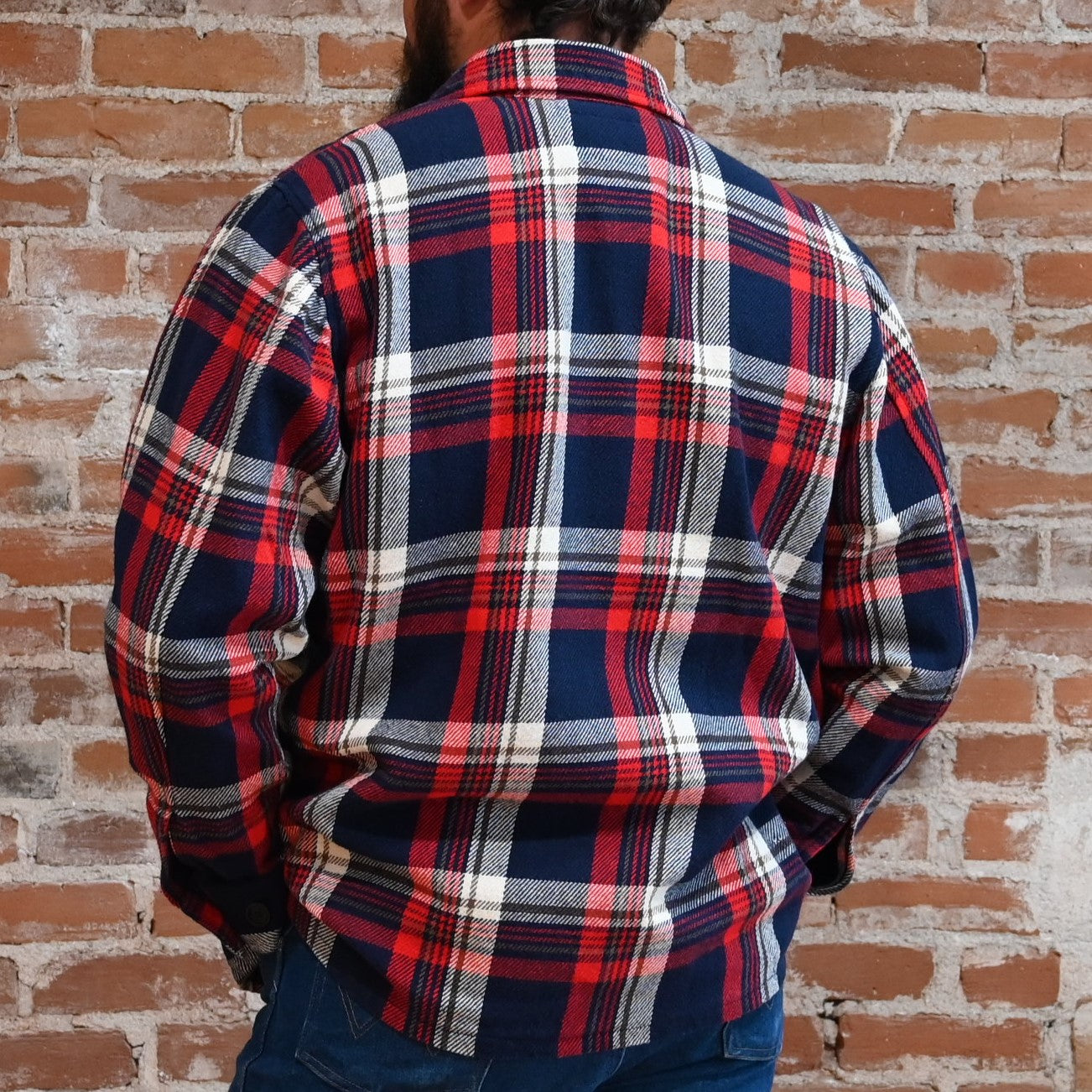 View of Filson Deer Island Ranch Coat in Navy/Red Multi Plaid and Dark Tan/Sycamore Plaid featuring button-front closure and patch pockets