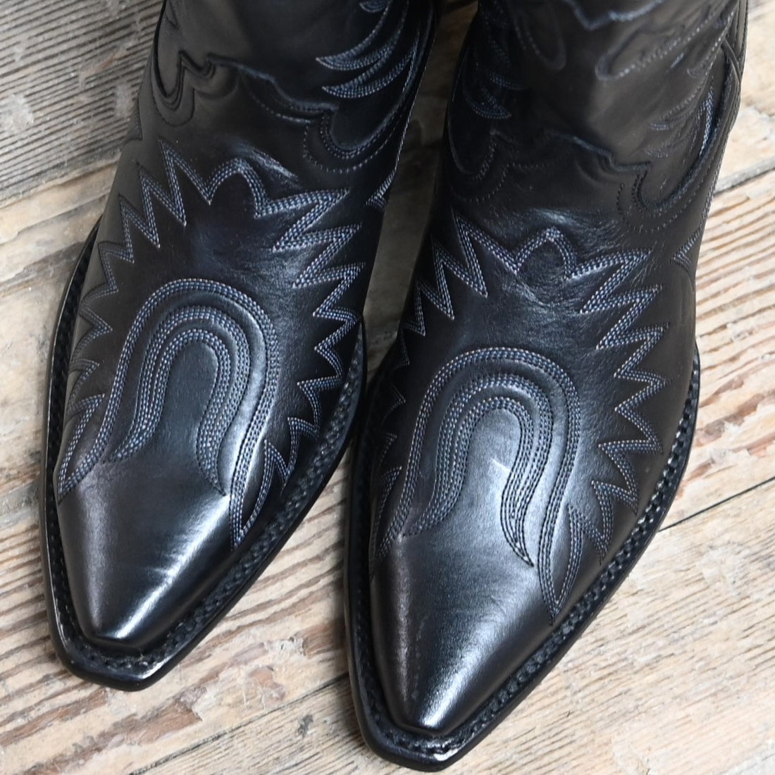 View of Hyer ROAD TO ARIZONA 13" boots showcasing black Ranch Hand cowhide vamp and upper with full boot embroidery, fashion snip toe, and leather stacked heel