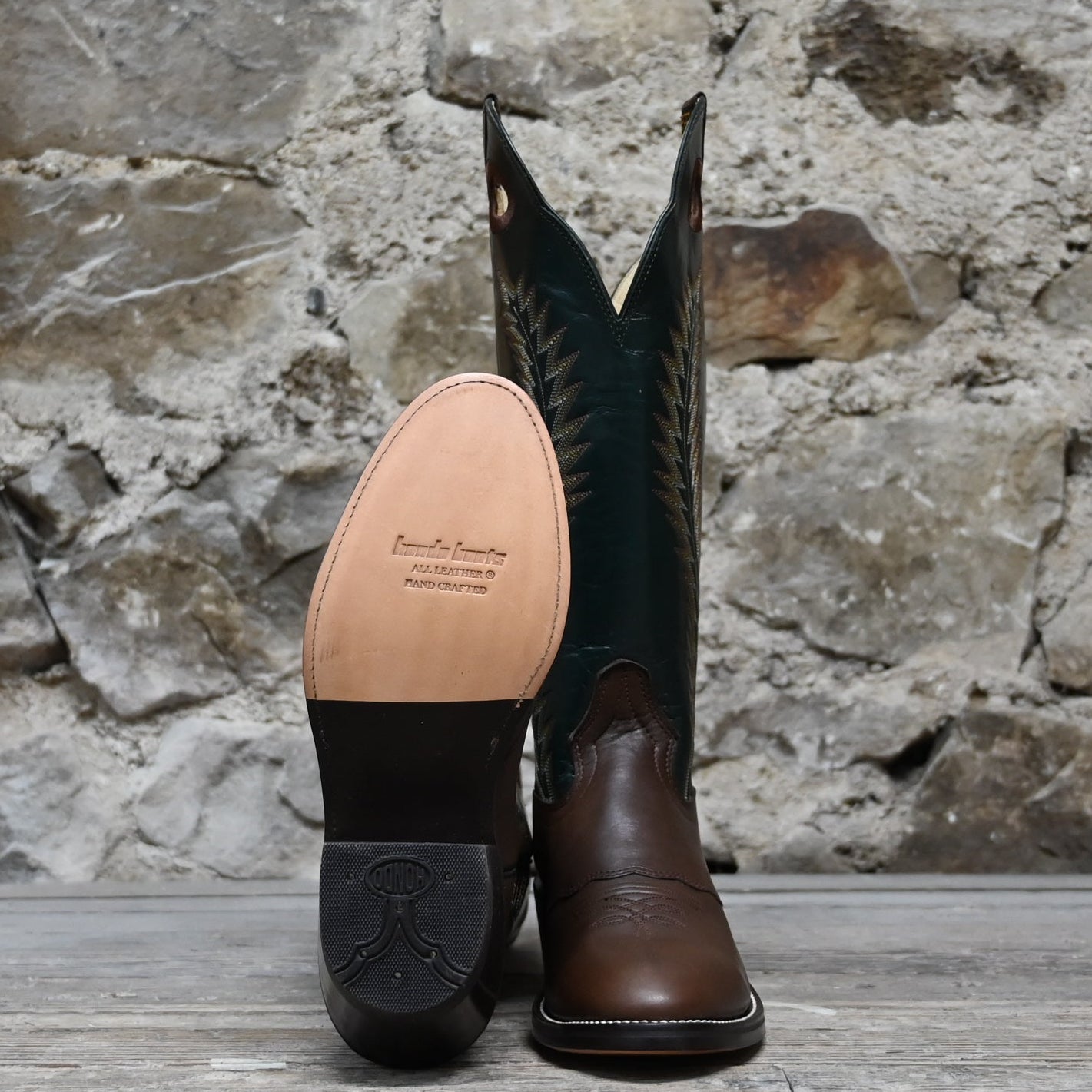 View of Hondo 16" cowboy boot with forest green top, brown retan vamp, pull holes, and spur ledge