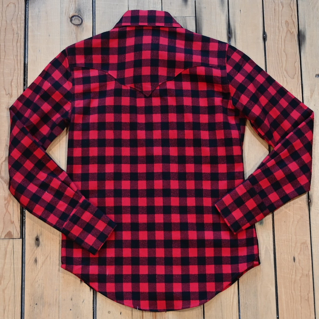 View of Ladies plush red and black buffalo check flannel Western shirt with sawtooth pockets and diamond snaps