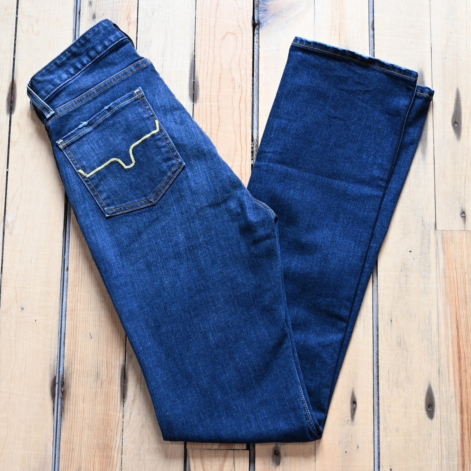 View of Kimes Ranch Sarah Jean in Blue Wash featuring high-rise waist, slim bootcut leg, and Longhorn logo