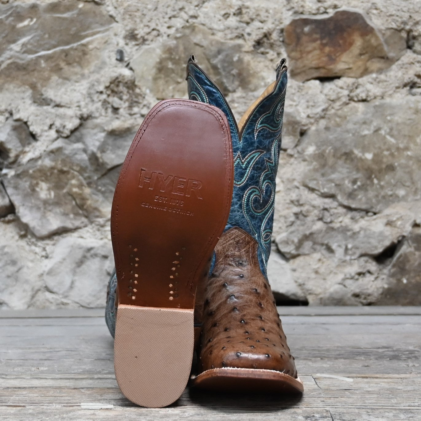 View of Hyer JETMORE 13" boots showcasing tabac full-quill waxy ostrich vamp and blue vintage goat upper with broad square toe and Stockman block heel