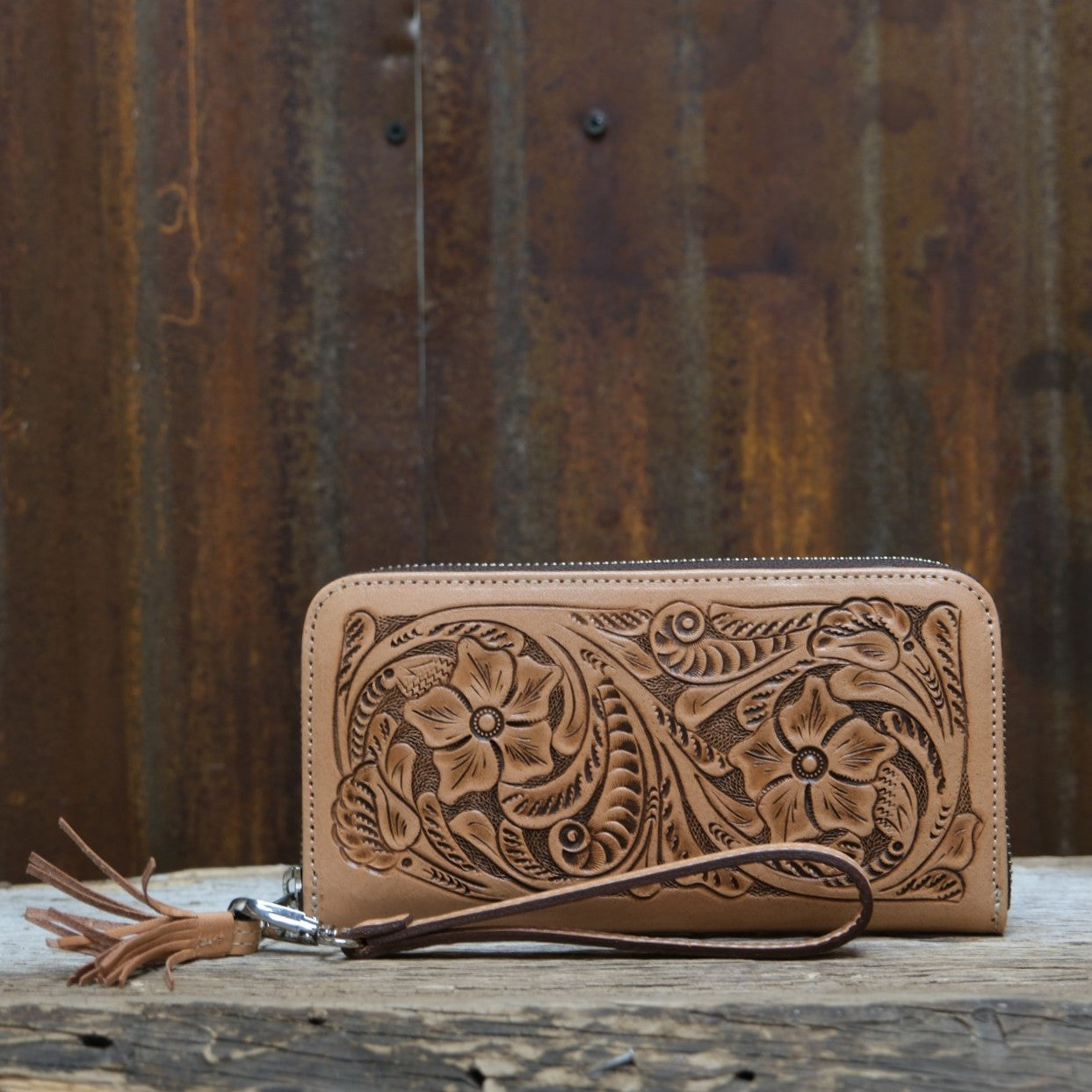 Que Chula natural tooled leather zip wallet with floral Western tooling and wrist strap