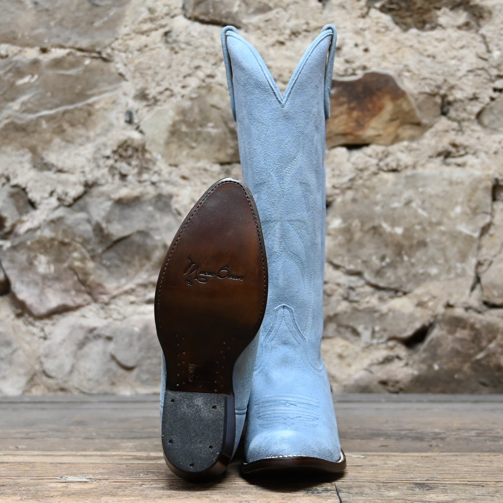 View of Macie Bean 15" baby blue suede boot with almond toe and cowgirl heel
