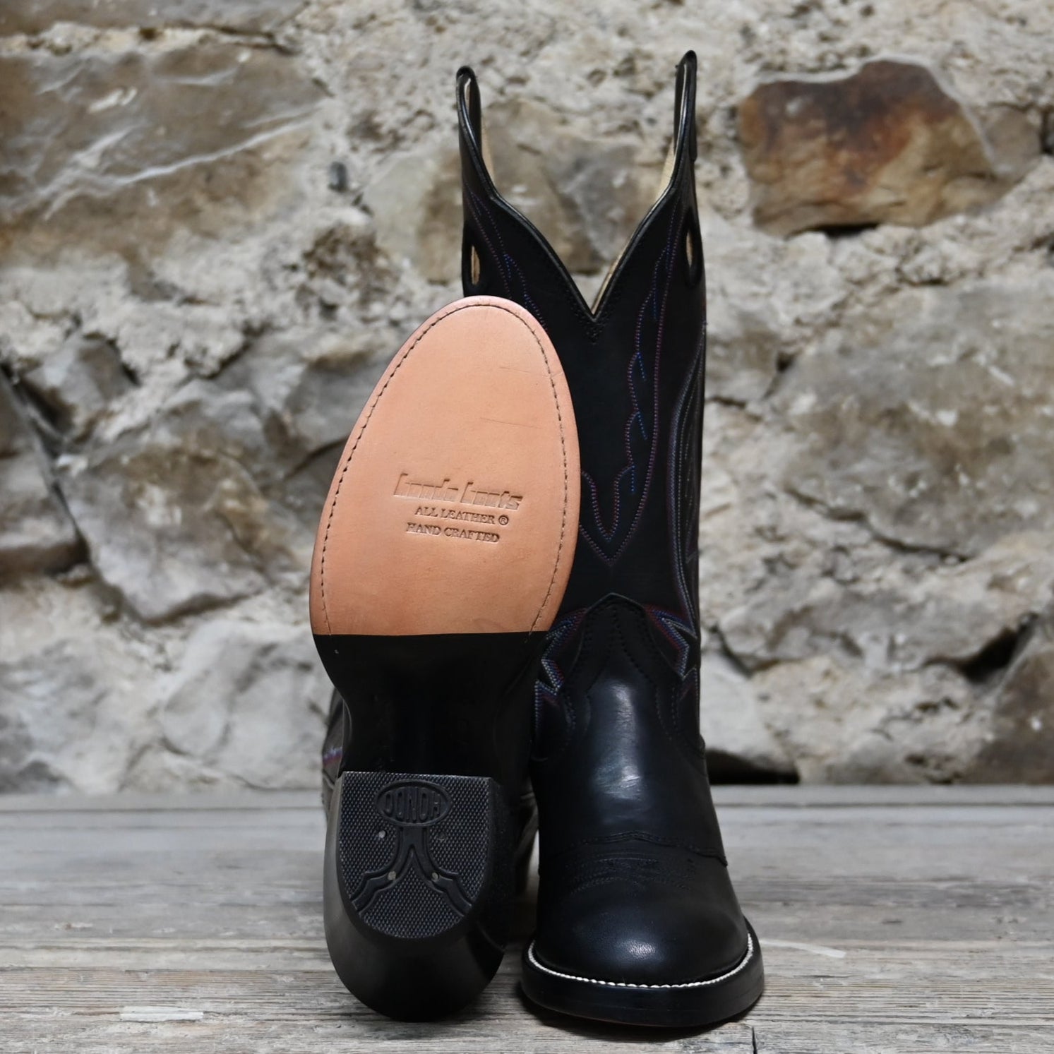 View of Hondo 14" cowboy boot in black retan leather with pull holes, spur ledge, and medium round toe